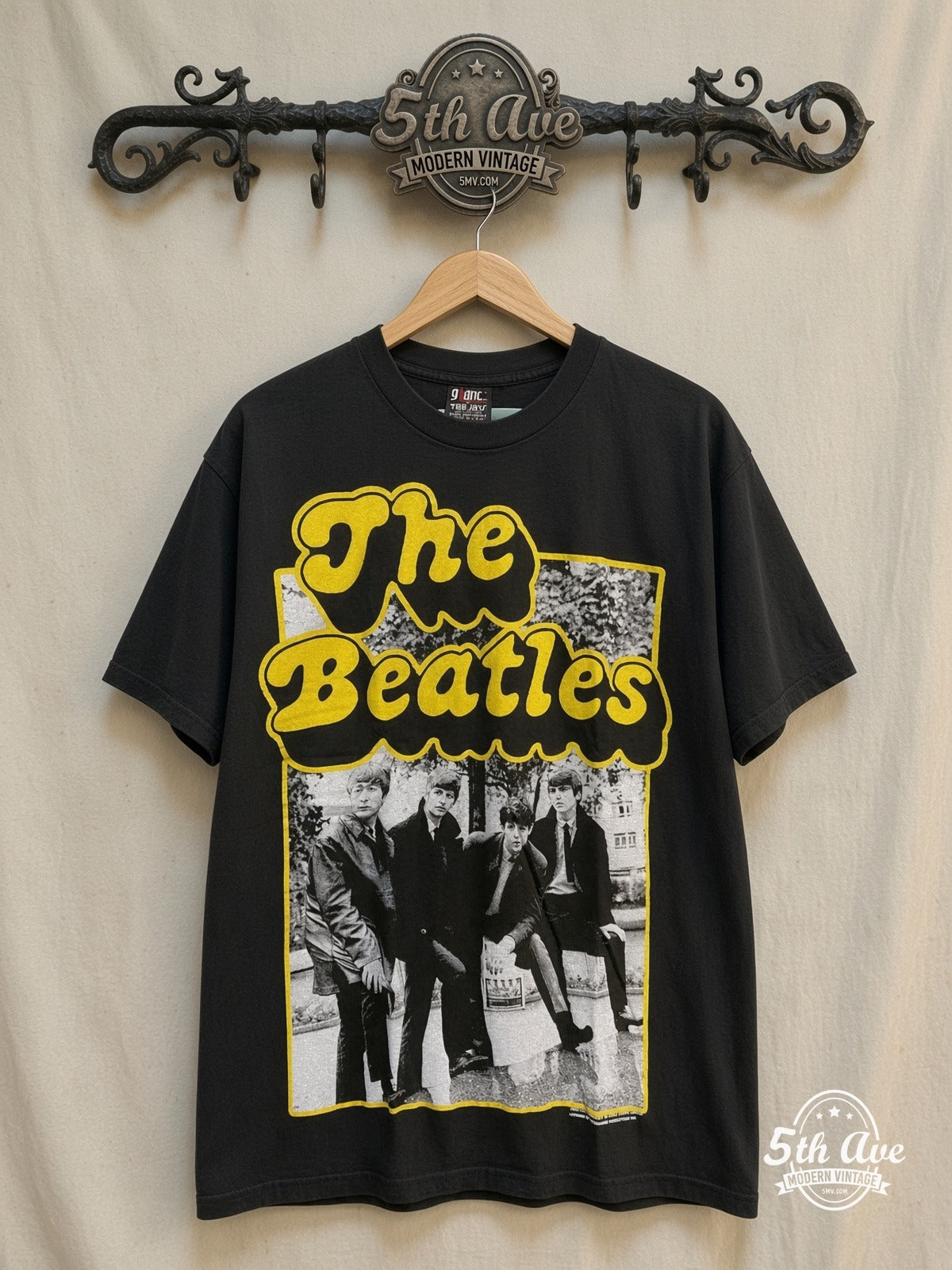 The Beatles – Yellow Border Early Suits Photo – Vintage Band T-Shirt — front on locked cream ornate 5th Ave rack