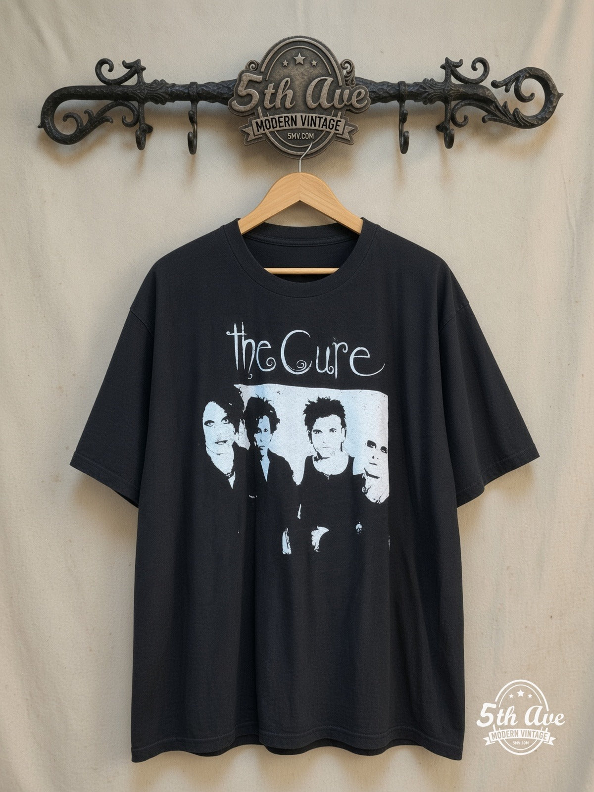 The Cure – Four Member Photo White Script – Vintage Band T-Shirt — front on locked cream ornate 5th Ave rack