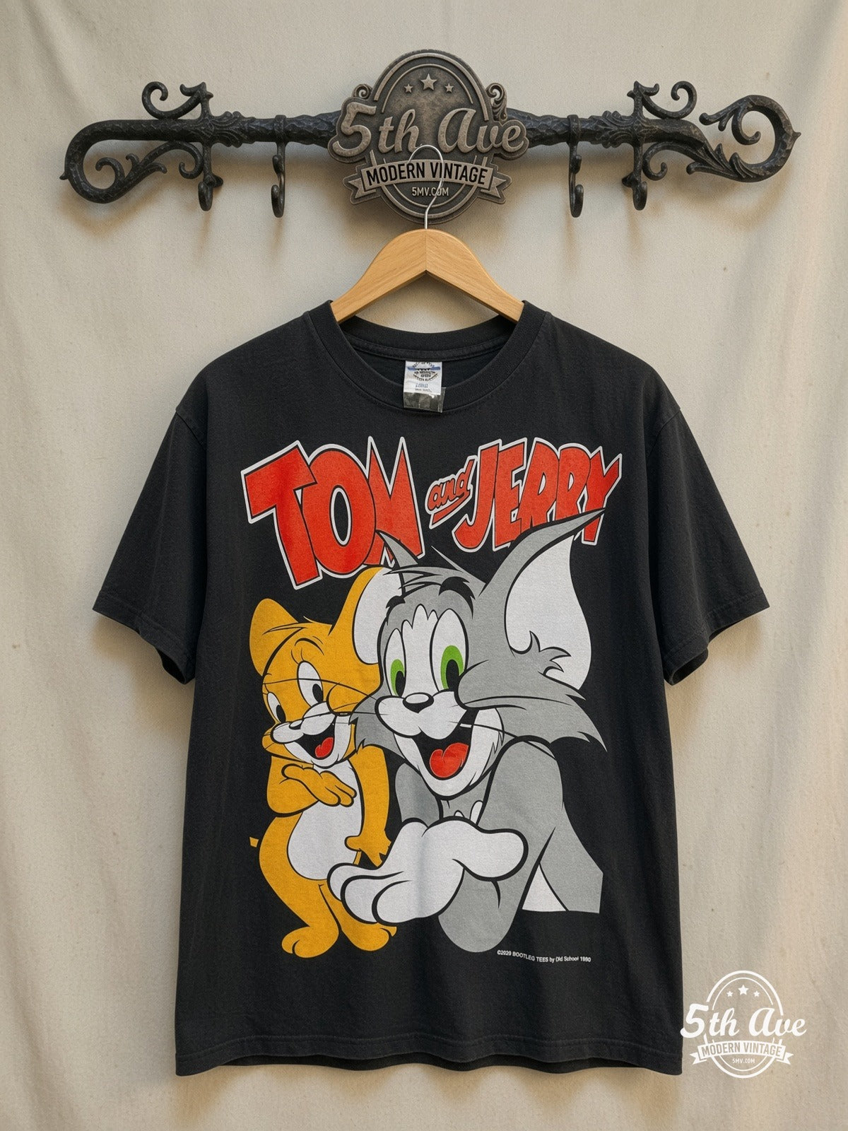 Tom and Jerry – New Vintage Graphic Tee — front on locked cream ornate 5th Ave rack