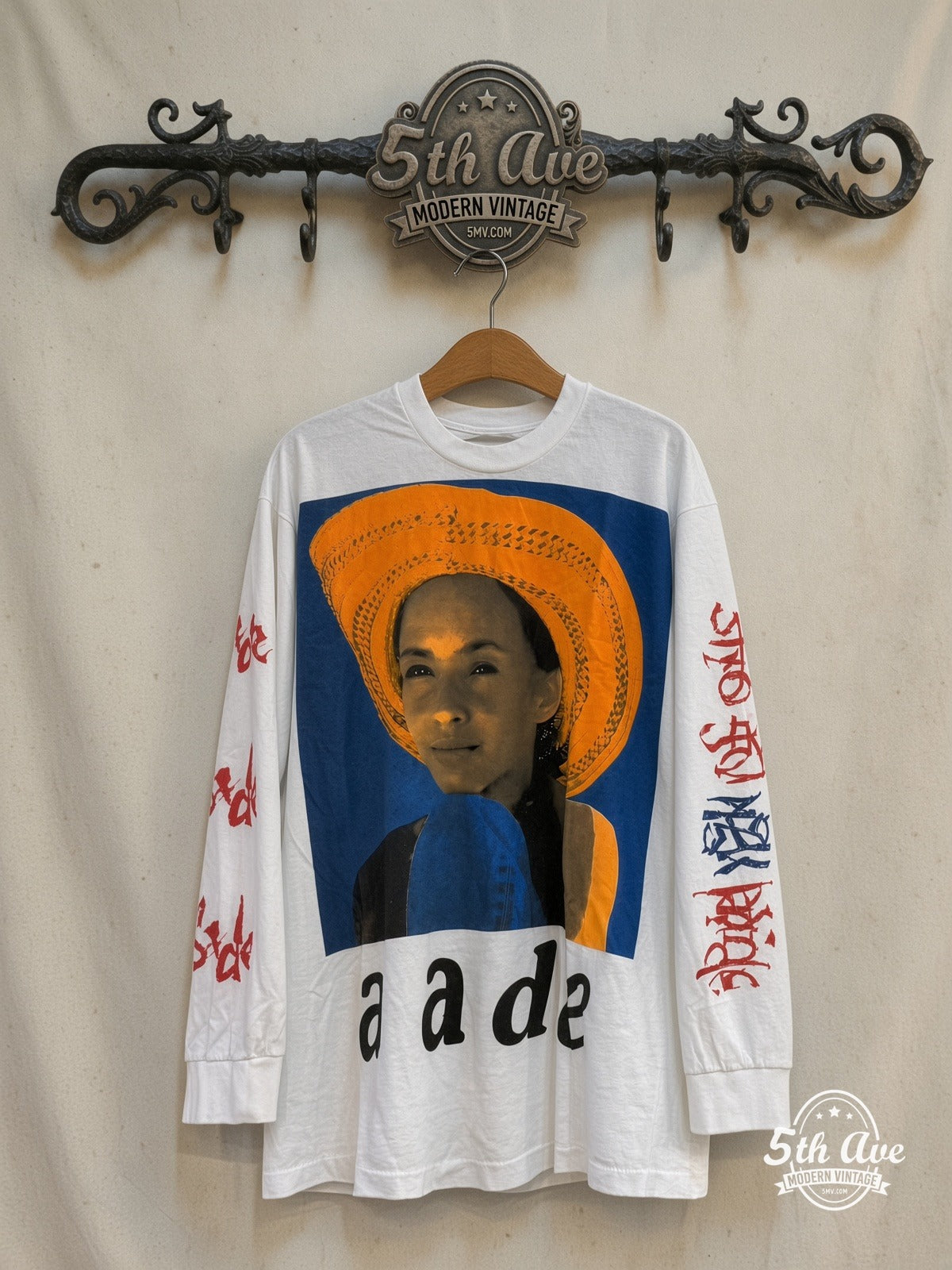 Sade – Love Is Stronger Than Pride Long Sleeve – Vintage Band T-Shirt — front on locked cream ornate 5th Ave rack