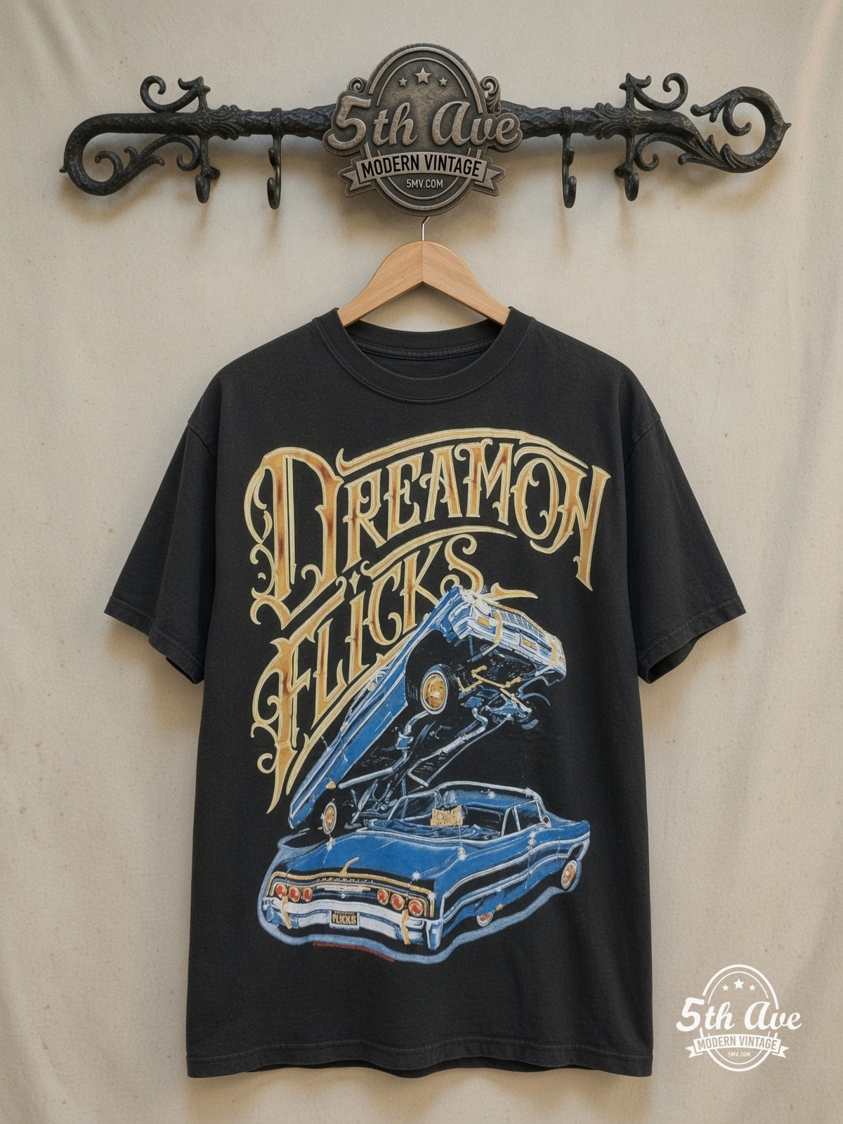 Rollin Hard – Lowrider Dreams and Hydraulic Scenes – Vintage Graphic Tee — front on locked cream ornate 5th Ave rack