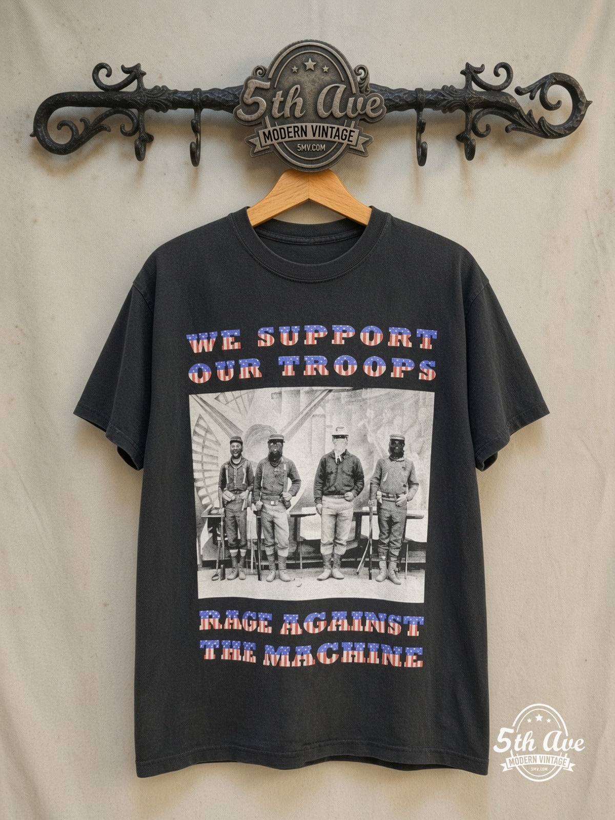 Rage Against the Machine – We Support Our Troops' North American Tour 1997 – Vintage Band T-Shirt — front on locked cream ornate 5th Ave rack