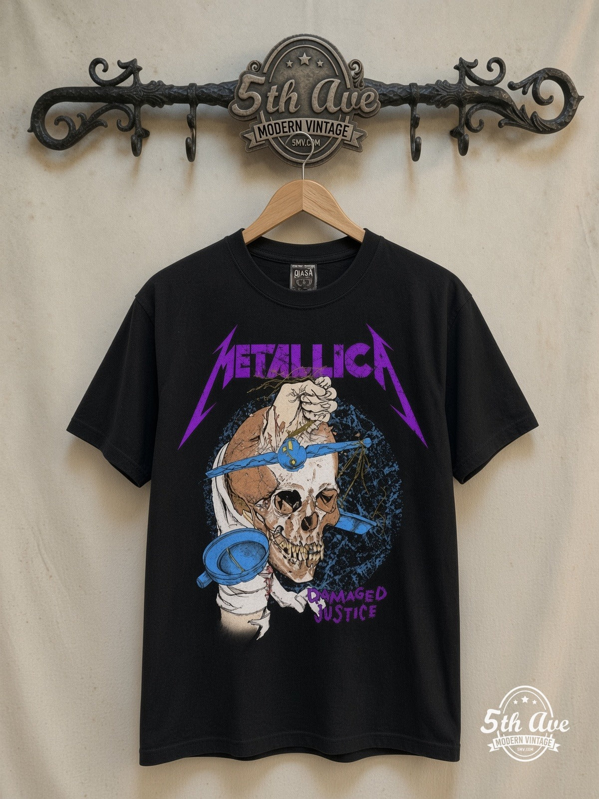 Metallica – Damaged Justice Skull Scales – Vintage Band T-Shirt — front on locked cream ornate 5th Ave rack