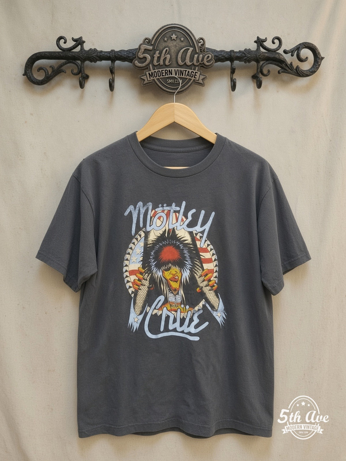 Mötley Crüe – Nikki Sixx American Flag Breakthrough – Vintage Band T-Shirt — front on locked cream ornate 5th Ave rack