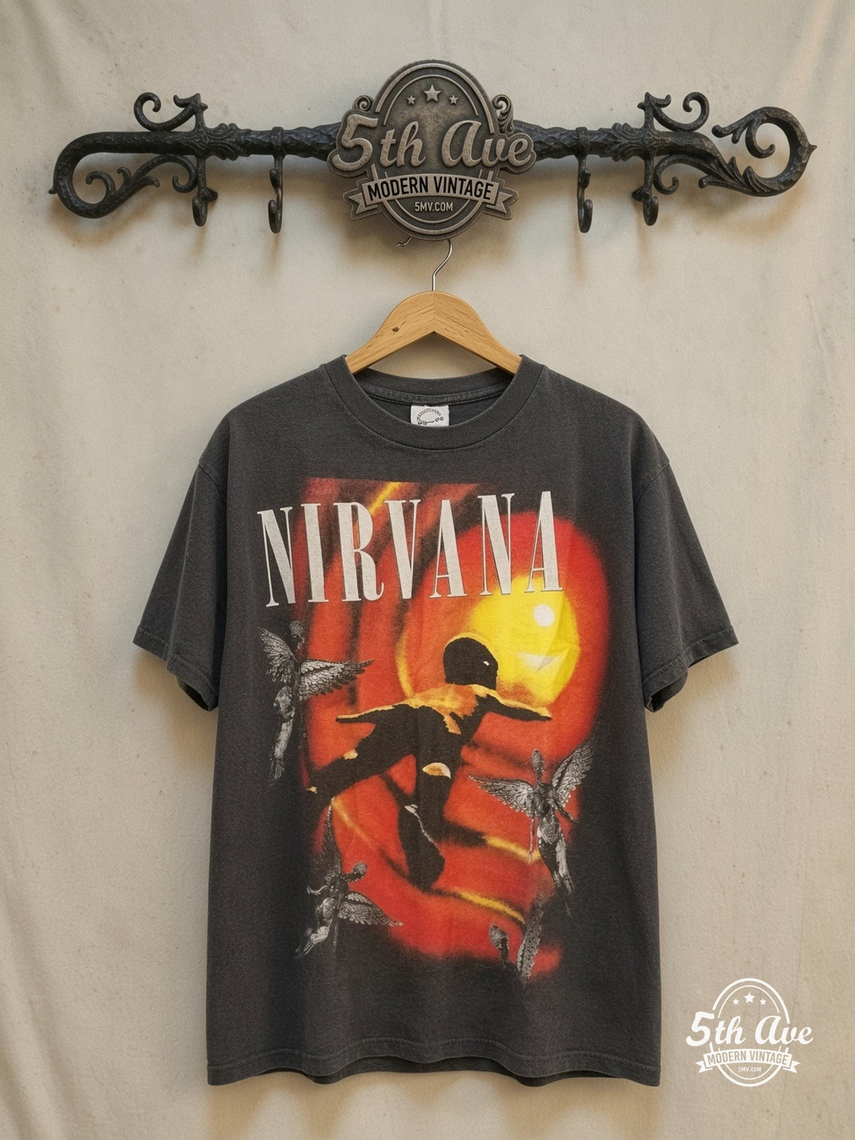 Nirvana – Bootleg Portrait – Vintage Band T-Shirt — front on locked cream ornate 5th Ave rack