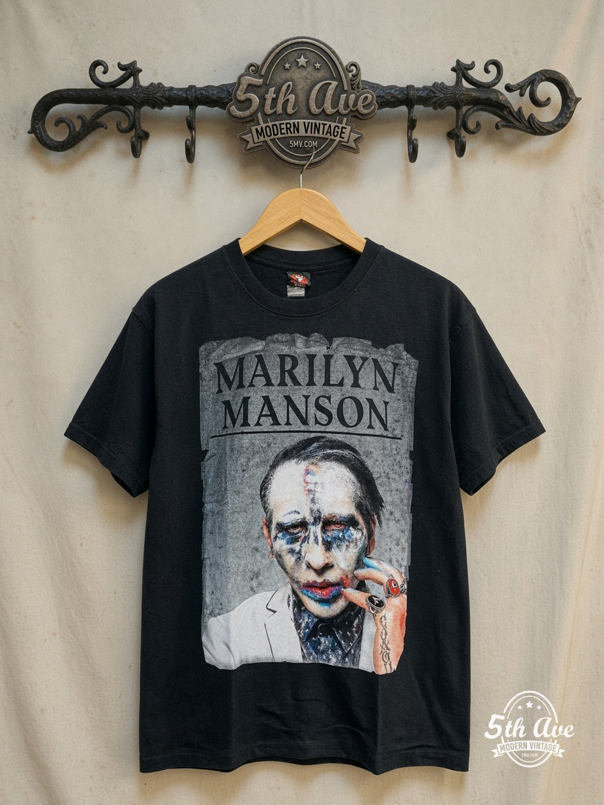 Marilyn Manson – Retro Vintage Classic Band T-Shirt – Vintage Band T-Shirt — front on locked cream ornate 5th Ave rack