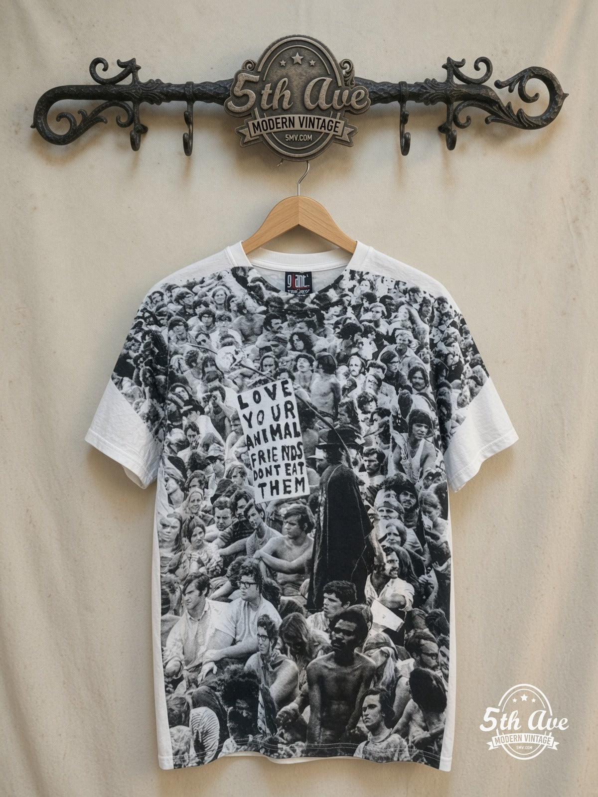 Woodstock – Love Your Animal Friends, Don't Eat Them – All Over Print – Vintage Graphic Tee — front on locked cream ornate 5th Ave rack