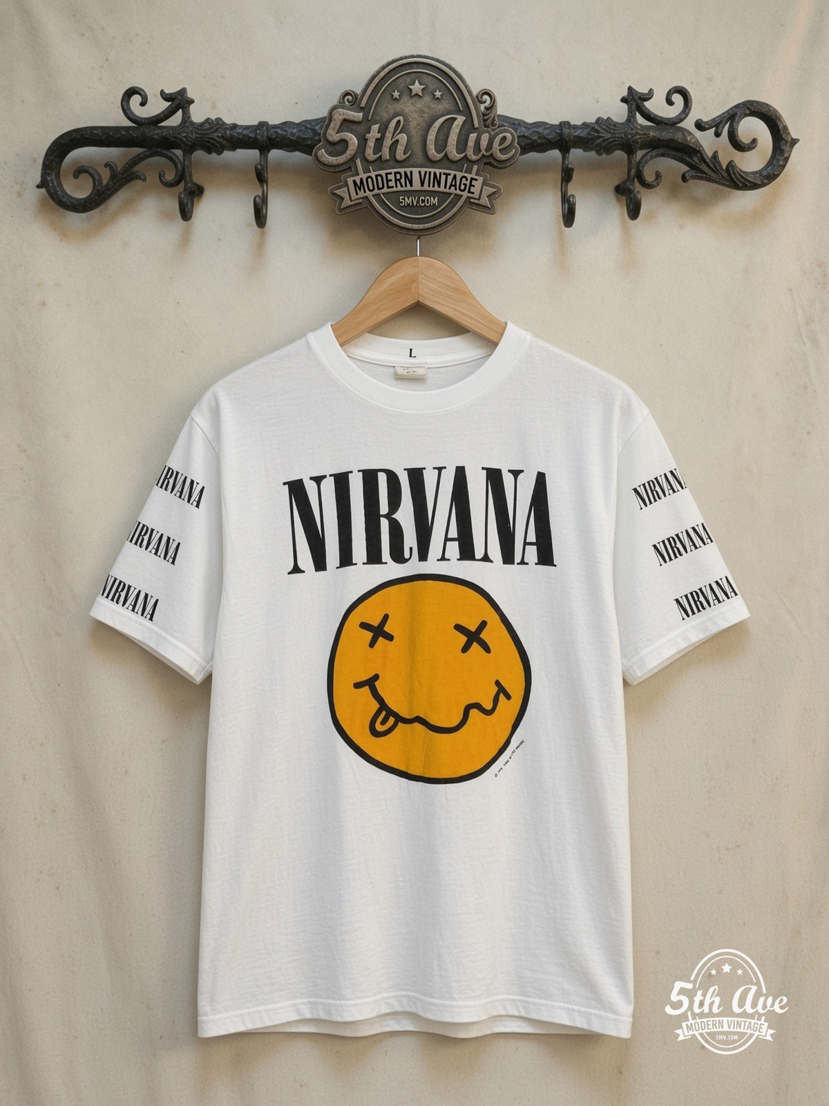 Nirvana – SMILEY Men's Large Long Sleeve 100% Cotton New Vintage Band T-Shirt – Vintage Band T-Shirt — front on locked cream ornate 5th Ave rack