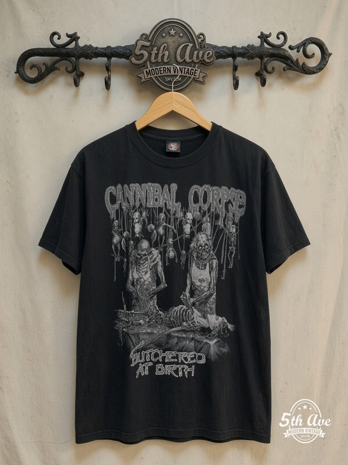 Cannibal Corpse – Butchered at Birth – Vintage Band T-Shirt — front on locked cream ornate 5th Ave rack