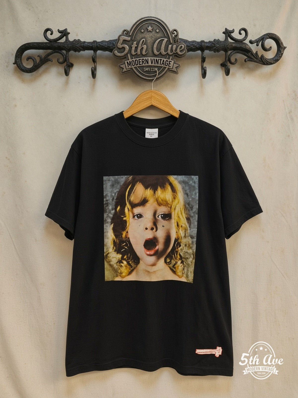 Acmé de la vie – Shocked Girl – Vintage Graphic Tee — front on locked cream ornate 5th Ave rack