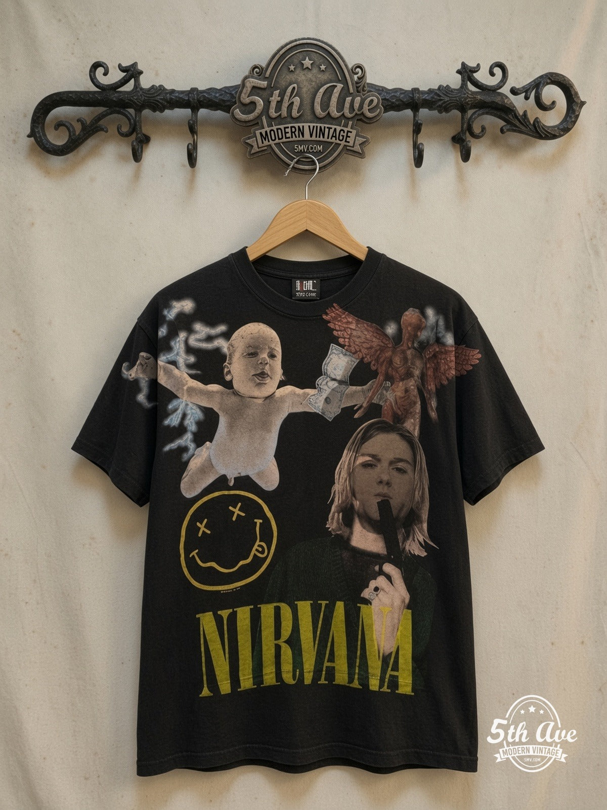 Nirvana – Nevermind Baby Smiley Kurt Collage All Over Print – Vintage Band T-Shirt — front on locked cream ornate 5th Ave rack
