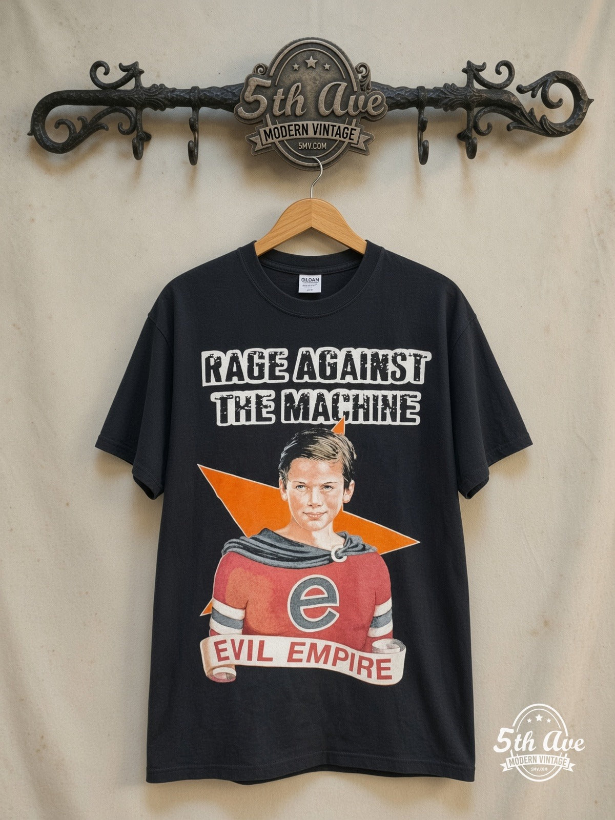 Rage Against the Machine – Evil Empire Boy Orange Star Back – Vintage Band T-Shirt — front on locked cream ornate 5th Ave rack