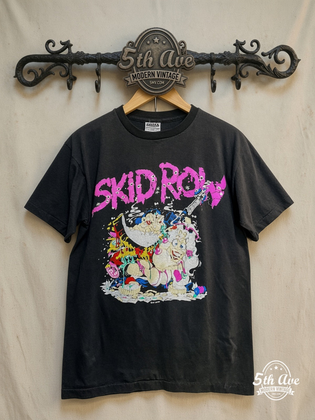 Skid Row – Eat Fuck Kill – Vintage Band T-Shirt — front on locked cream ornate 5th Ave rack