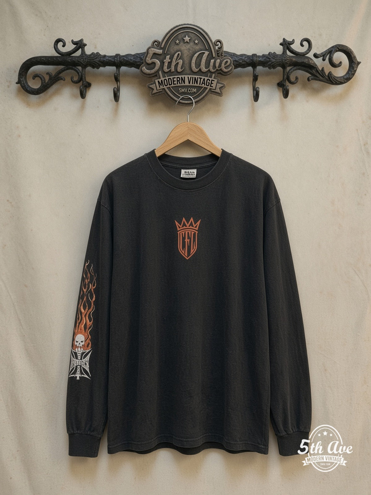 West Coast Choppers Orange Iron Cross CFL Crown long sleeve t-shirt, front view on a display rack