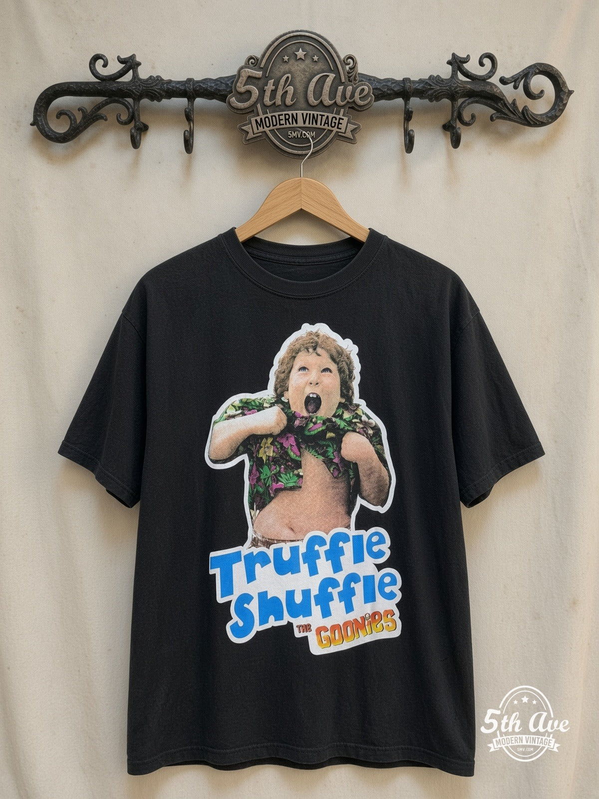 The Goonies – Truffle Shuffle – Vintage Movie Tee — front on locked cream ornate 5th Ave rack
