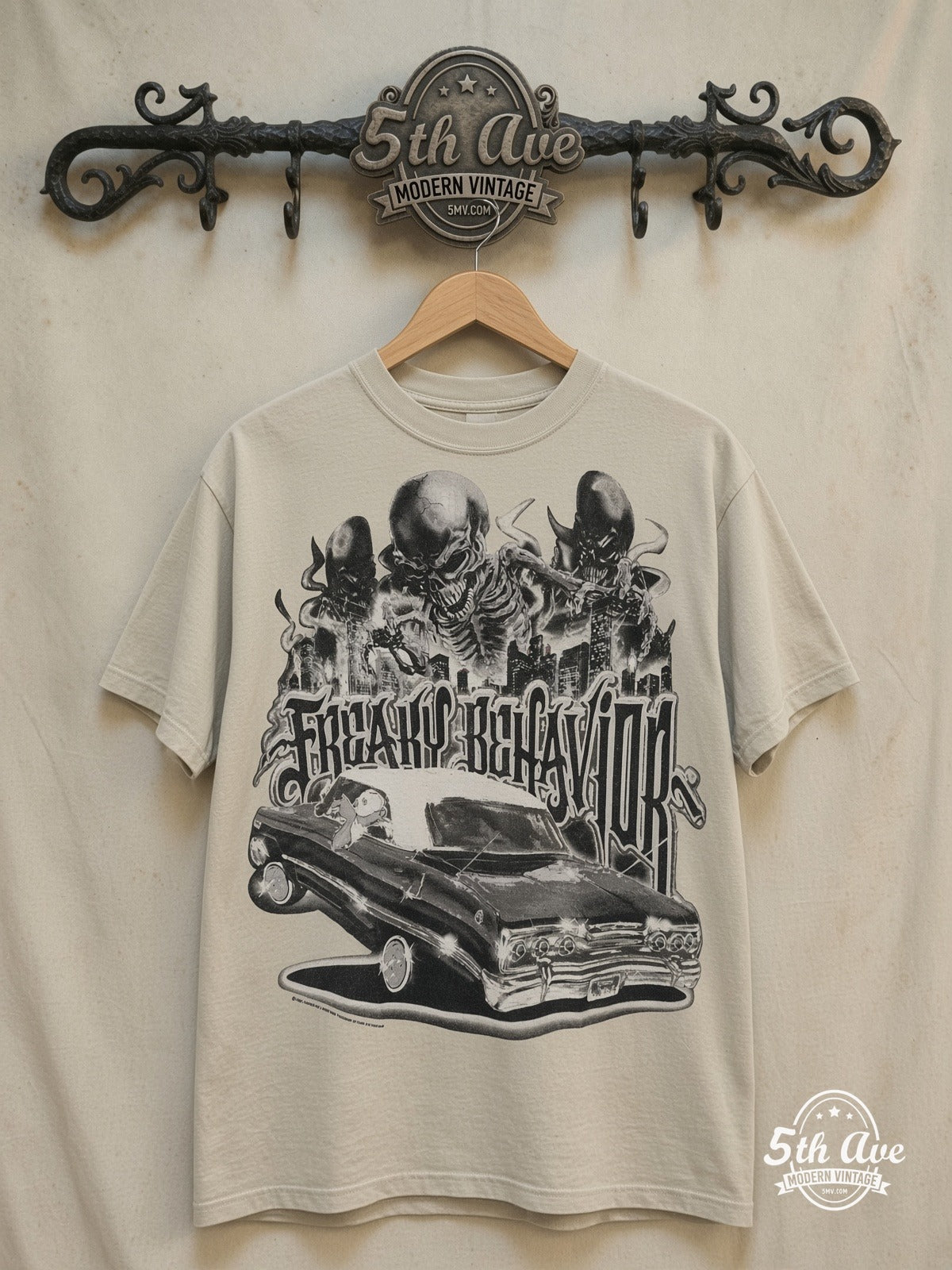 Freaky Behavior - Rollin hard lowrider low rider car culture t shirt – Vintage Band T-Shirt — front on locked cream ornate 5th Ave rack