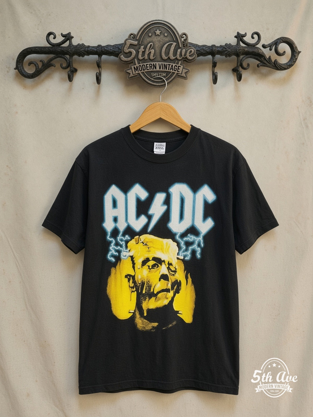 AC/DC – Meltdown – Vintage Band T-Shirt — front on locked cream ornate 5th Ave rack