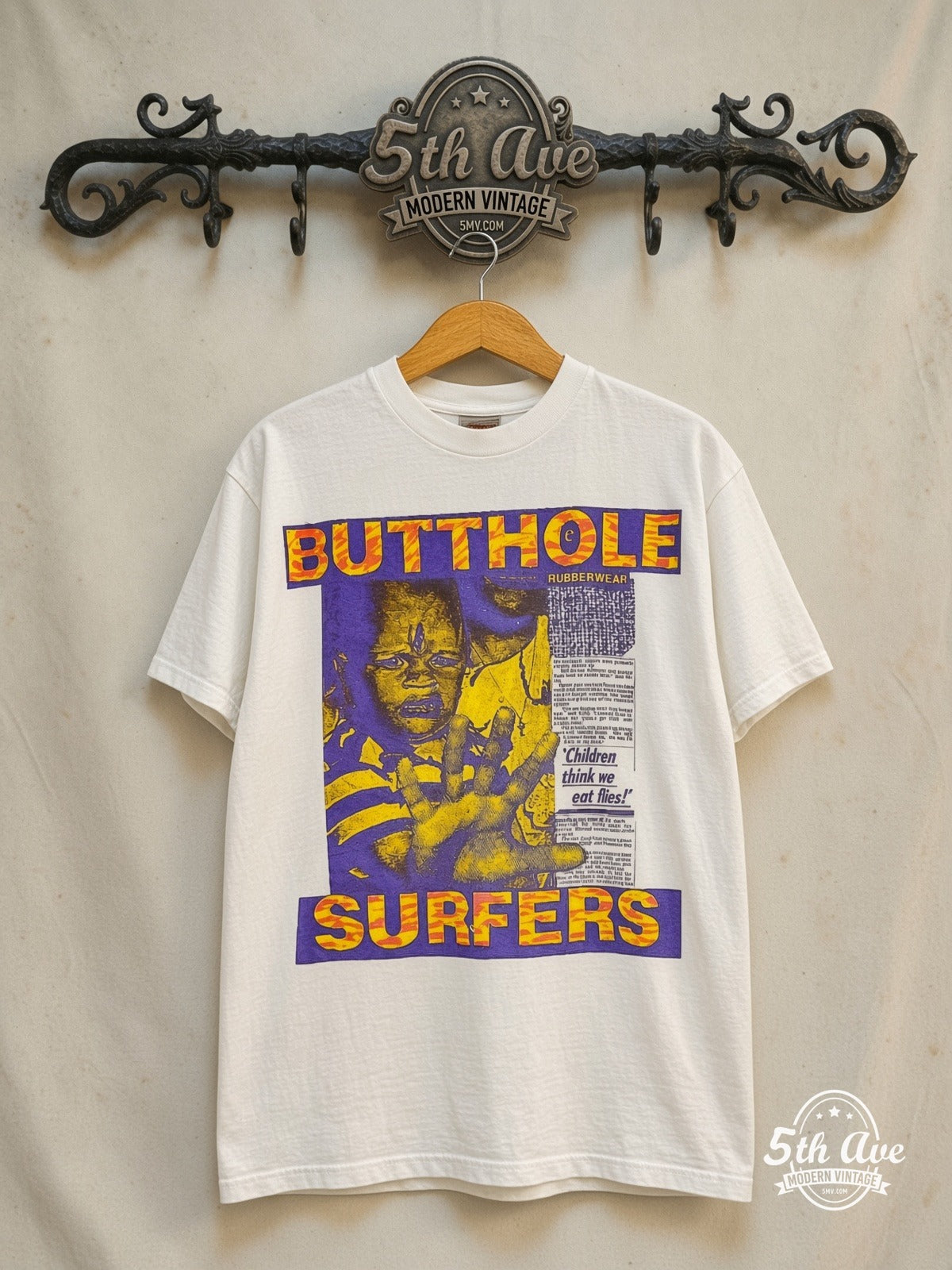 Butthole Surfers – Children Think We Eat Flies – Vintage Band T-Shirt — front on locked cream ornate 5th Ave rack