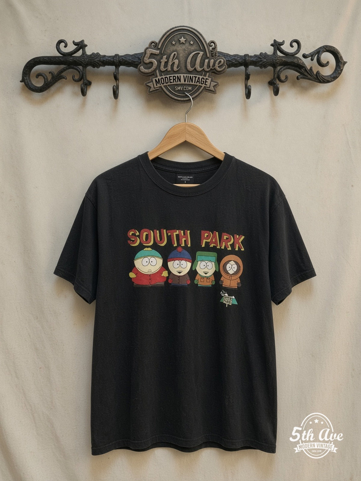 South Park – New Vintage Graphic Tee — front on locked cream ornate 5th Ave rack