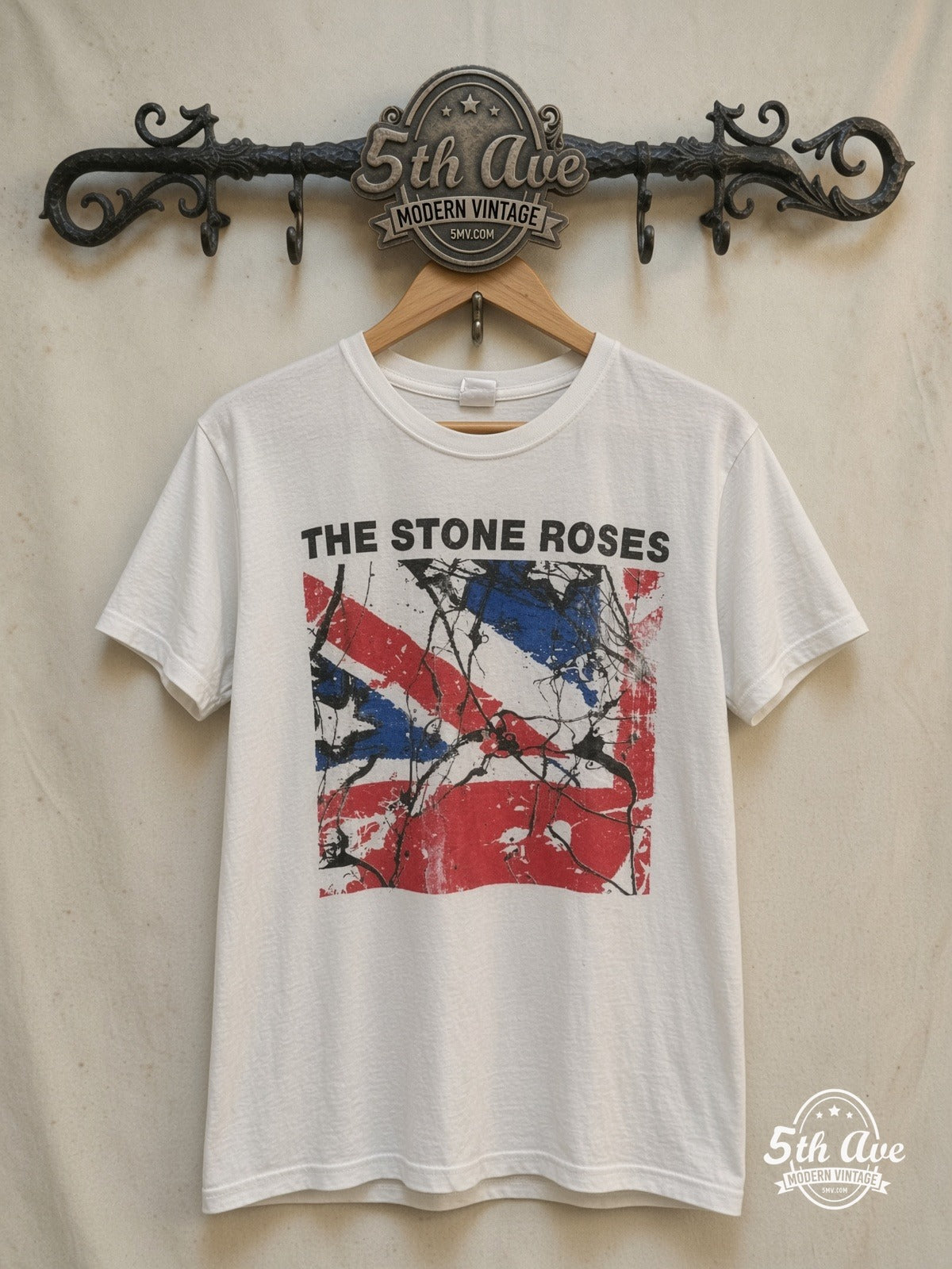 The Stone Roses – The Collection – Vintage Band T-Shirt — front on locked cream ornate 5th Ave rack
