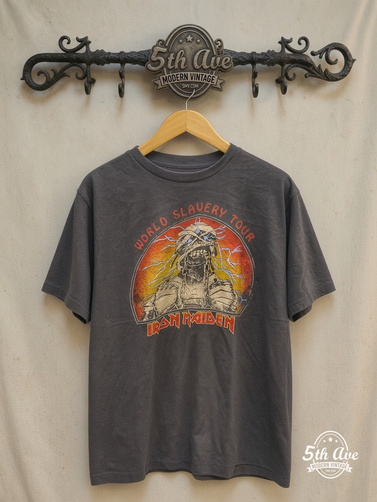 Iron Maiden – World Slavery Tour – Vintage Band T-Shirt — front on locked cream ornate 5th Ave rack