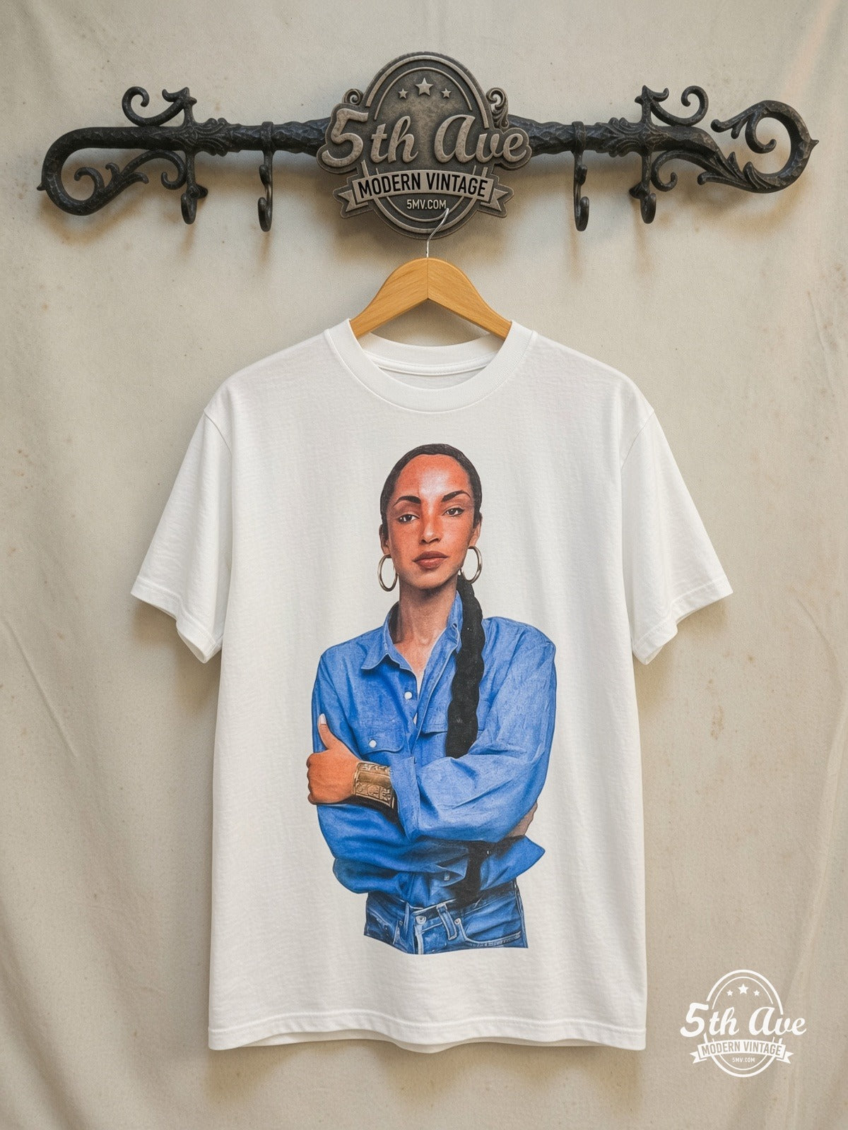 Sade – Queen of Cool Crossed Arms Denim White – Vintage Band T-Shirt — front on locked cream ornate 5th Ave rack