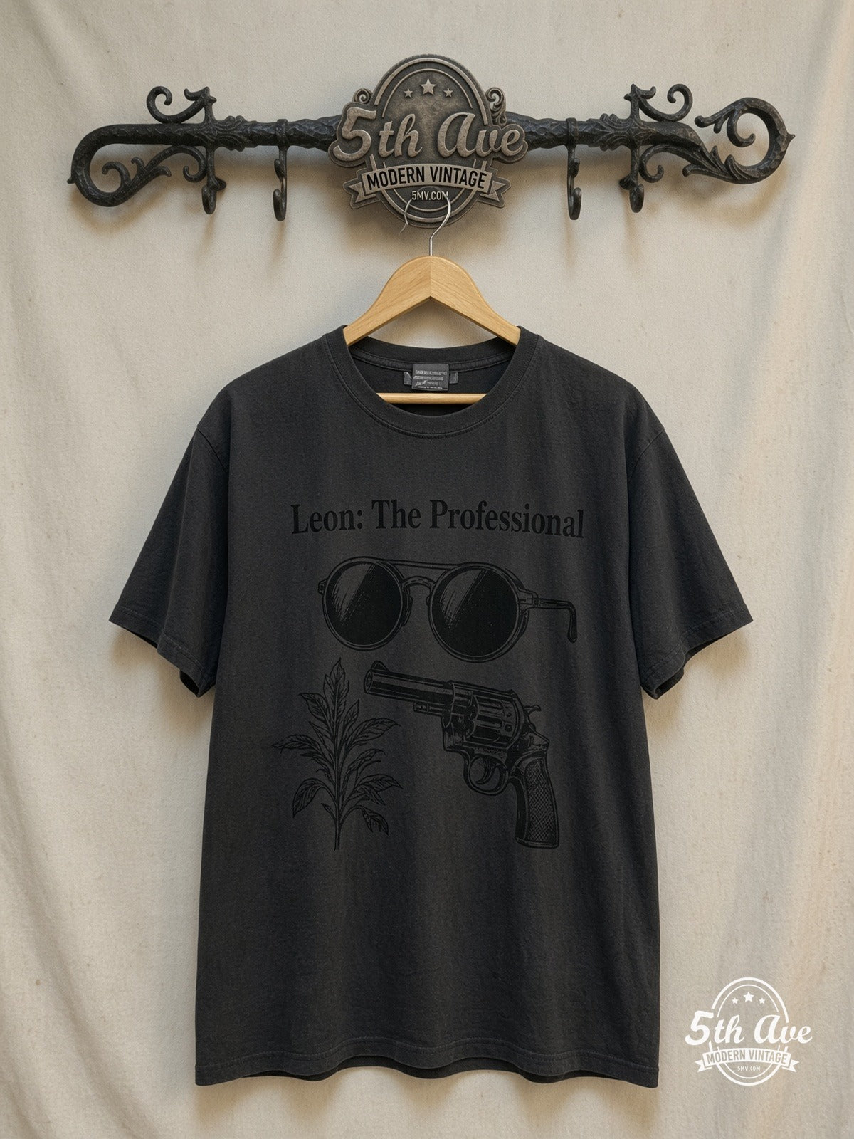 Leon: The Professional – Retro Movie Graphic – Vintage Movie Tee — front on locked cream ornate 5th Ave rack