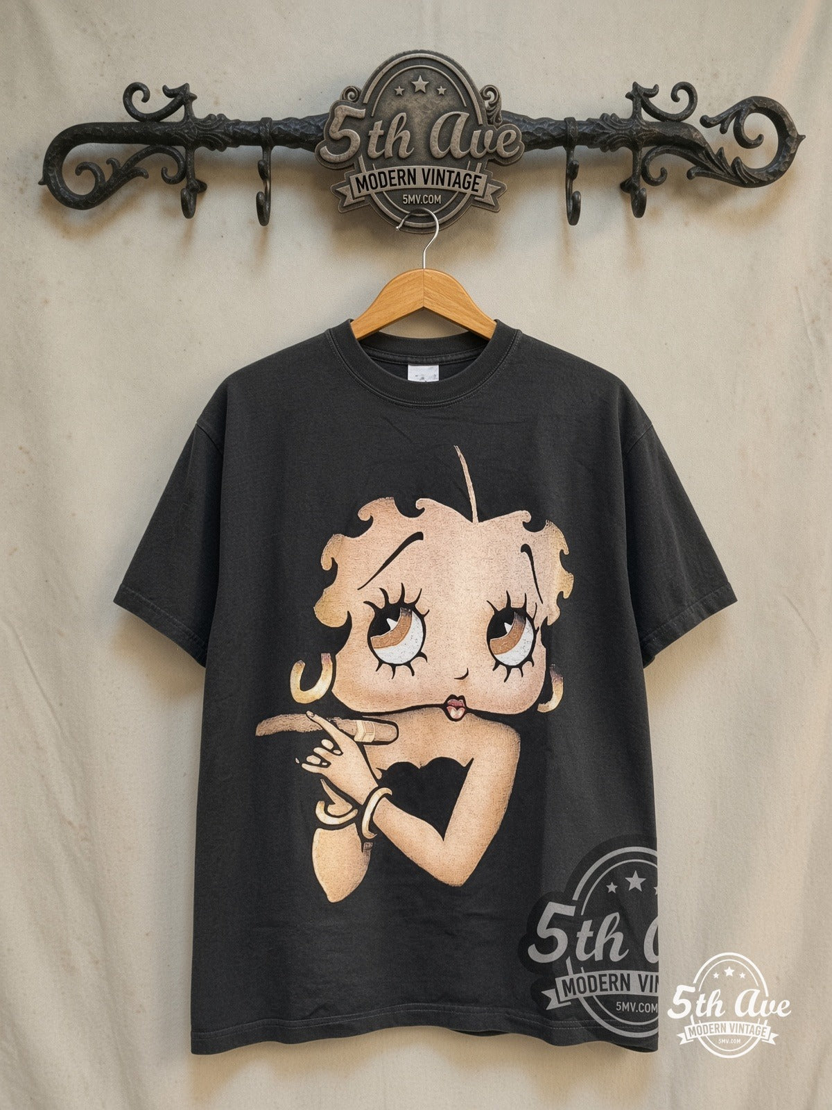 Betty Boop Hollyboop graphic tee in black, front view on a display rack