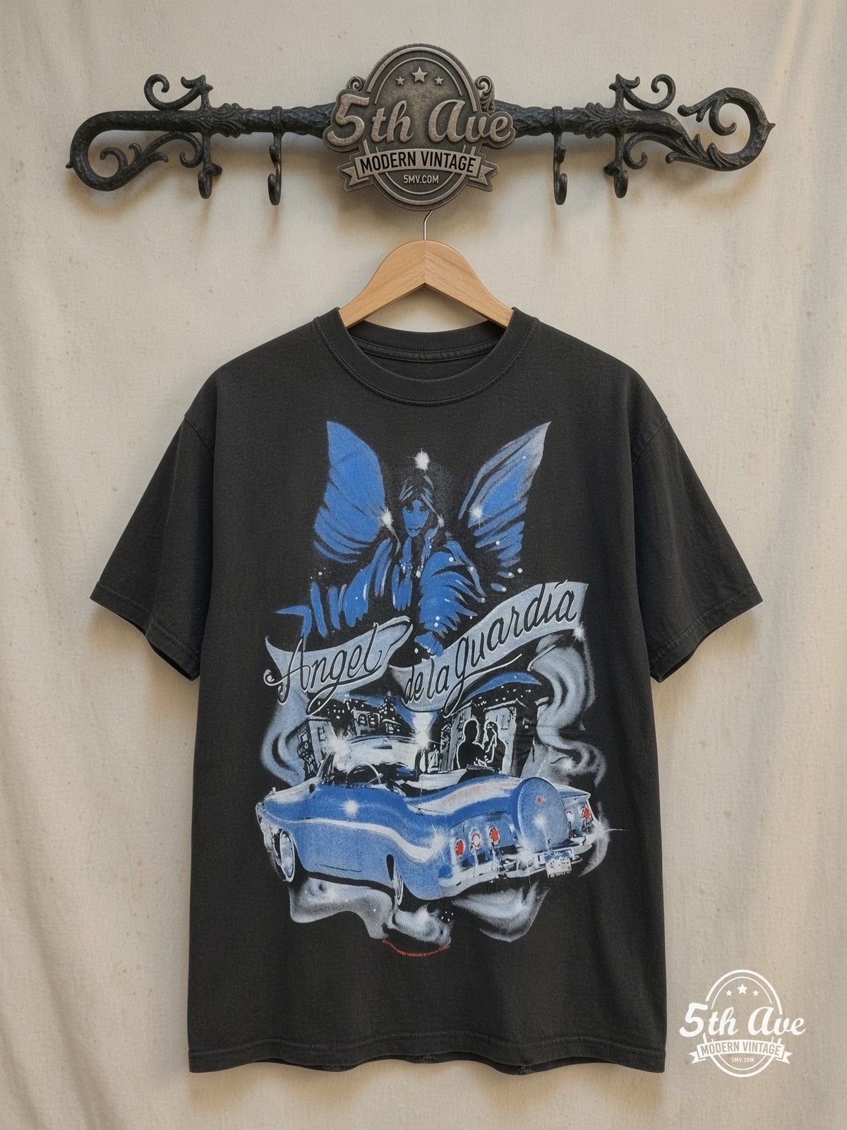 Rollin Hard – Angel de la Guardia Lowrider – Vintage Graphic Tee — front on locked cream ornate 5th Ave rack
