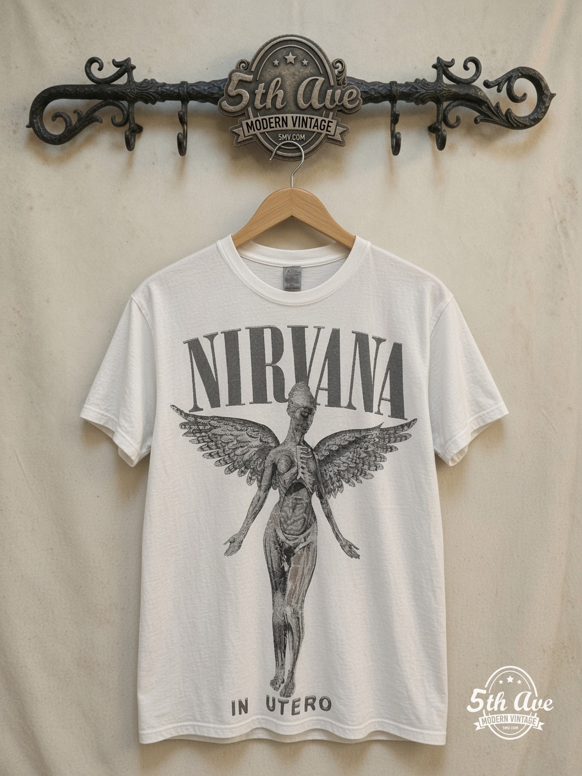 Nirvana – In Utero Blue Logo Angel White Tee – Vintage Band T-Shirt — front on locked cream ornate 5th Ave rack