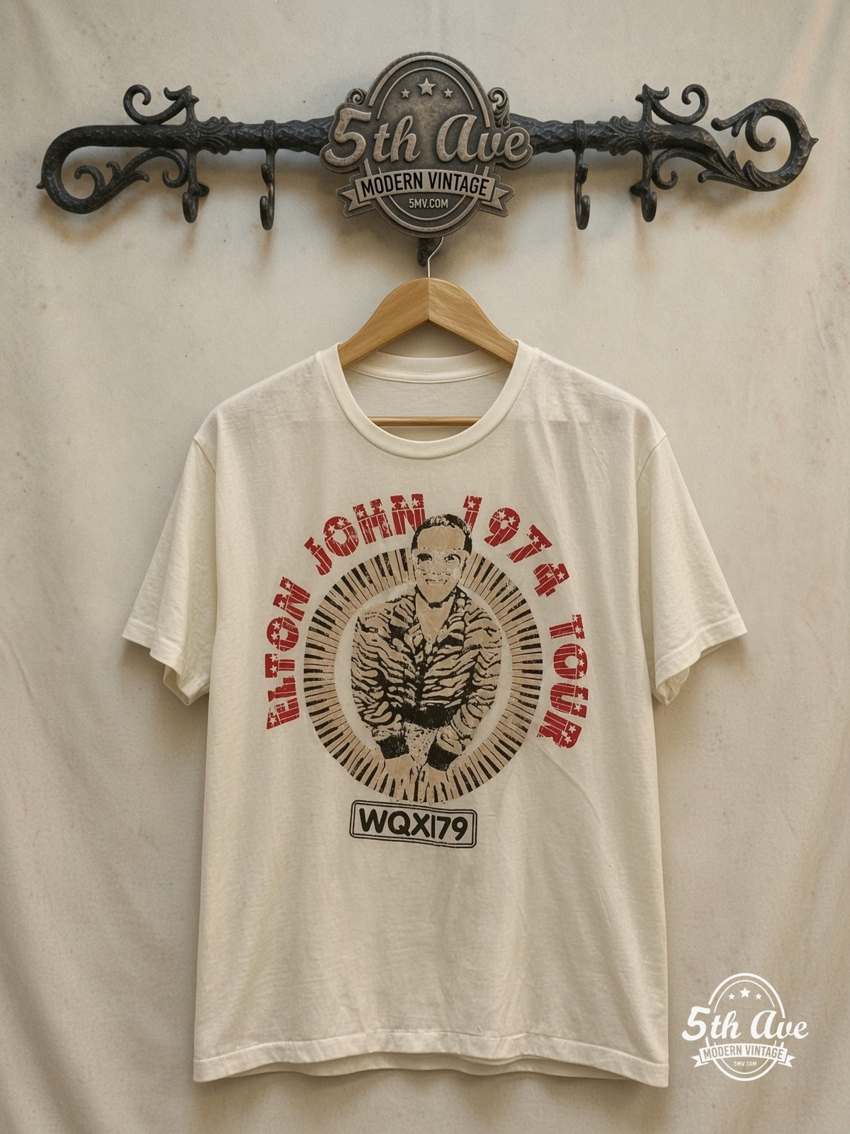 Elton John – 1974 Tour Concert – Vintage Band T-Shirt — front on locked cream ornate 5th Ave rack