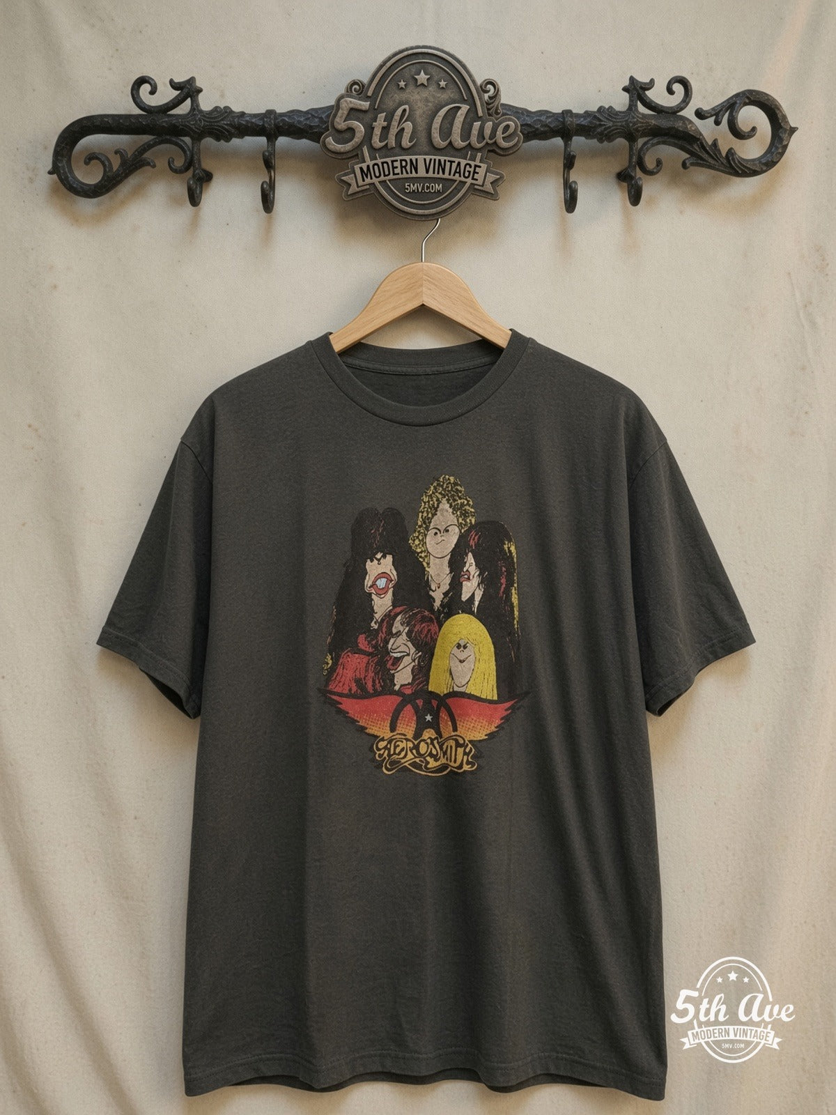 Aerosmith – Cartoon Caricatures – Vintage Band T-Shirt — front on locked cream ornate 5th Ave rack