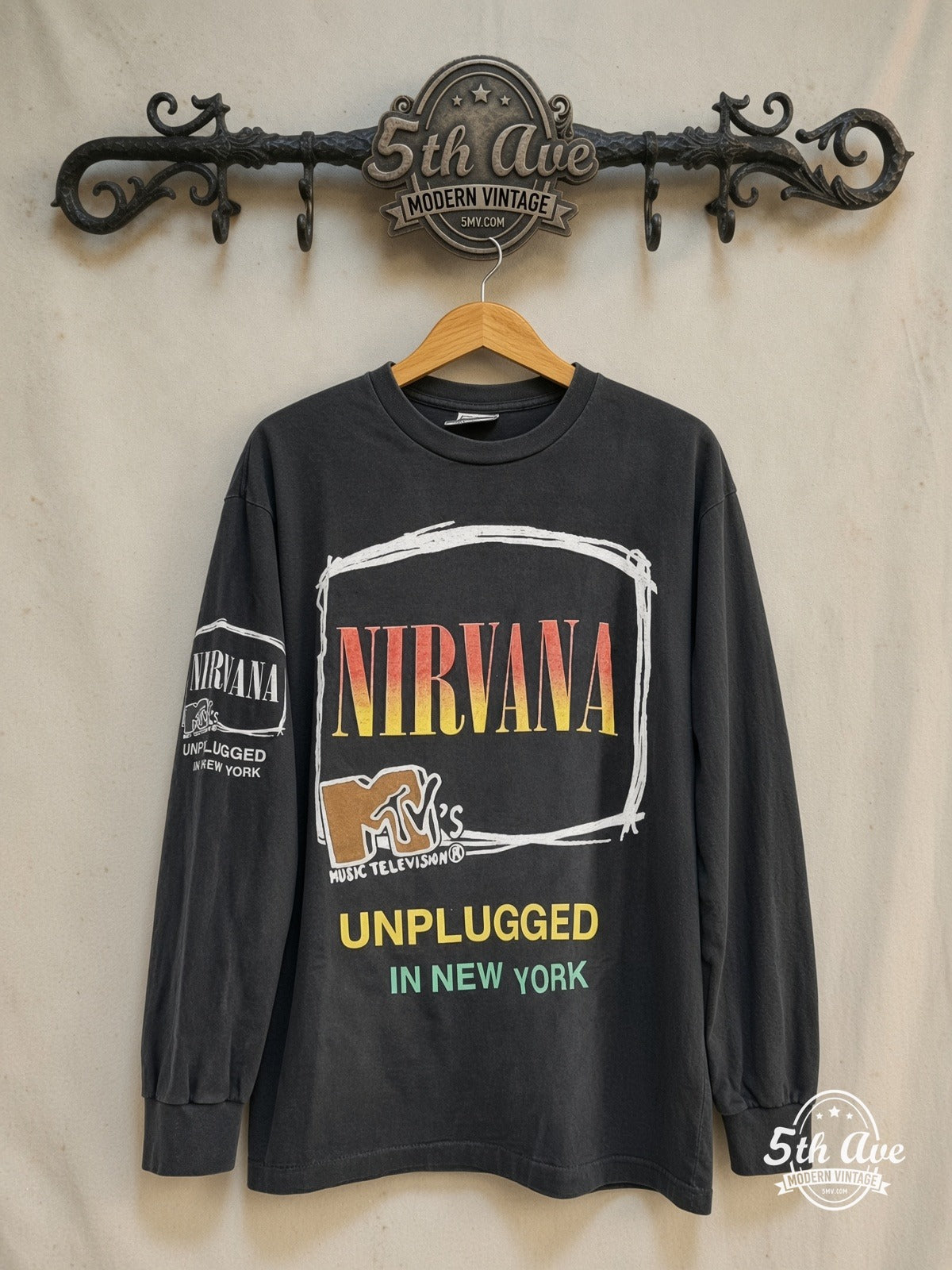 Nirvana – Unplugged' in New York – Vintage Band T-Shirt — front on locked cream ornate 5th Ave rack