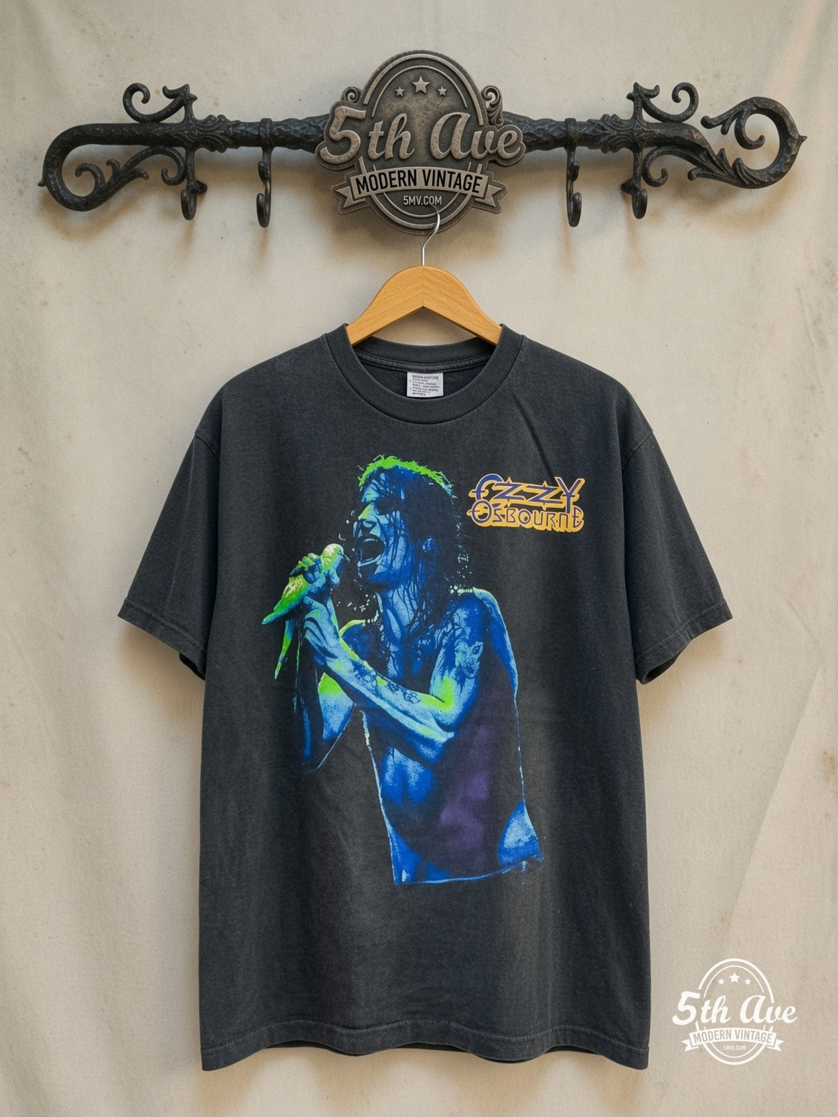 Ozzy Osbourne – Dove Mic Blue Portrait Severed Head – Vintage Band T-Shirt — front on locked cream ornate 5th Ave rack