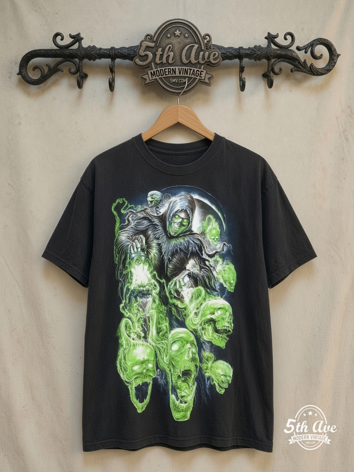 Reaper and Skulls Glow in the dark vintage band t-shirt, front view on a display rack
