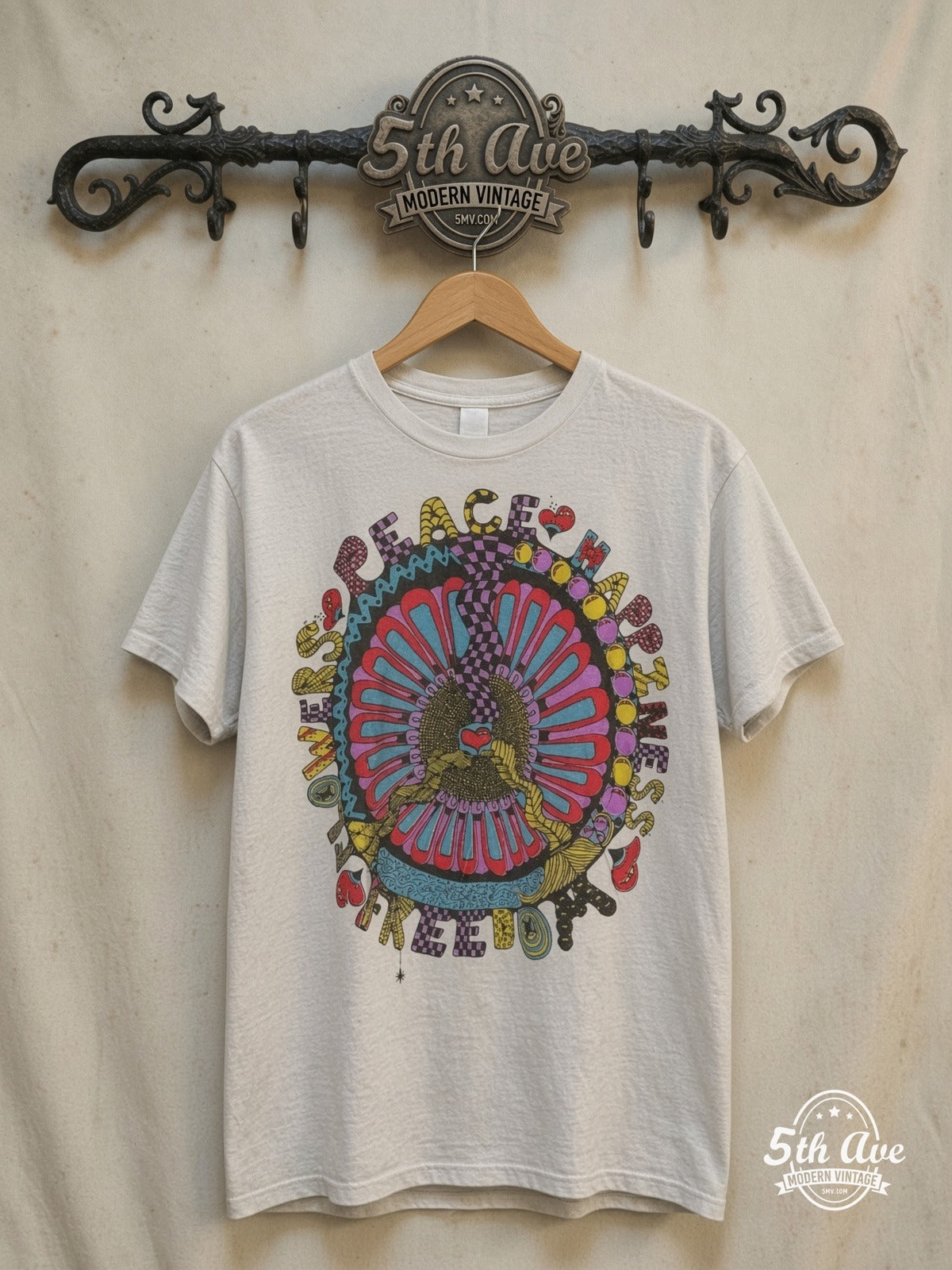 Bloom in Peace – Celebration of Happiness and Freedom – Vintage Graphic Tee — front on locked cream ornate 5th Ave rack
