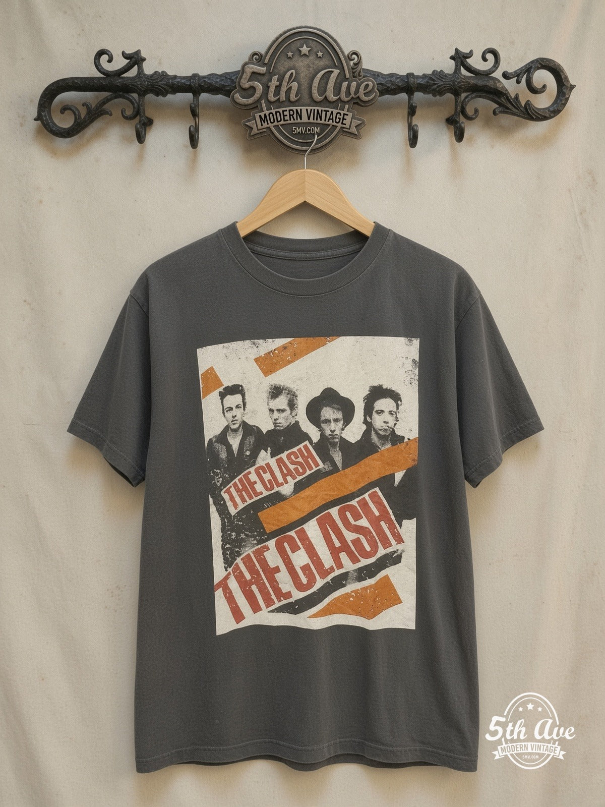 THE CLASH 100% Cotton New Vintage Band T-Shirt – Vintage Band T-Shirt — front on locked cream ornate 5th Ave rack
