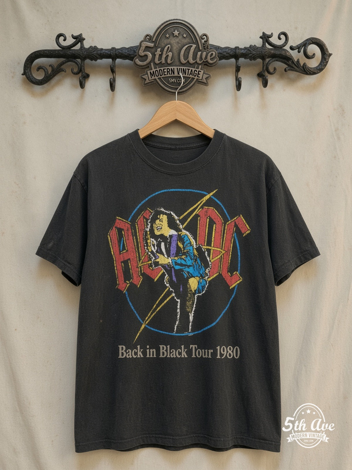 AC/DC – Back in Black Tour 1980 – Vintage Band T-Shirt — front on locked cream ornate 5th Ave rack