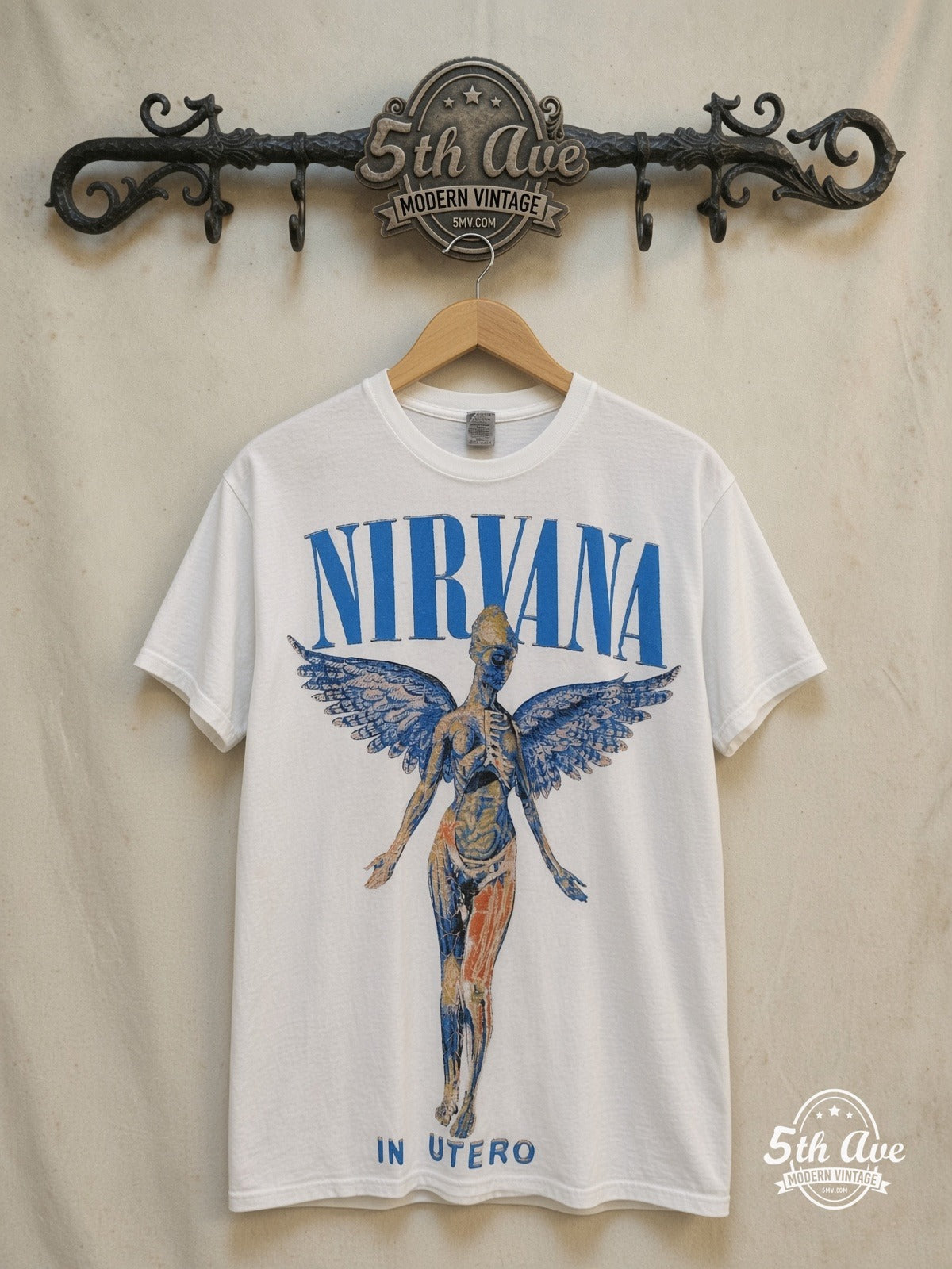 Nirvana In Utero Blue Logo Angel White vintage band t-shirt in white, front view on a display rack