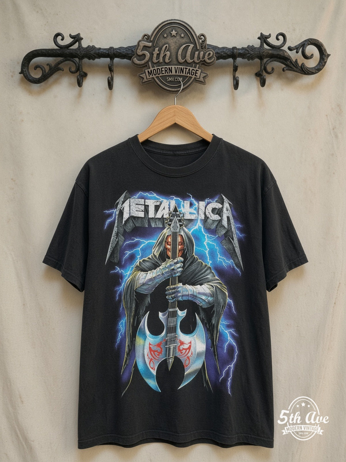 Metallica – Hooded Axe Guitar Blue Lightning – Vintage Band T-Shirt — front on locked cream ornate 5th Ave rack