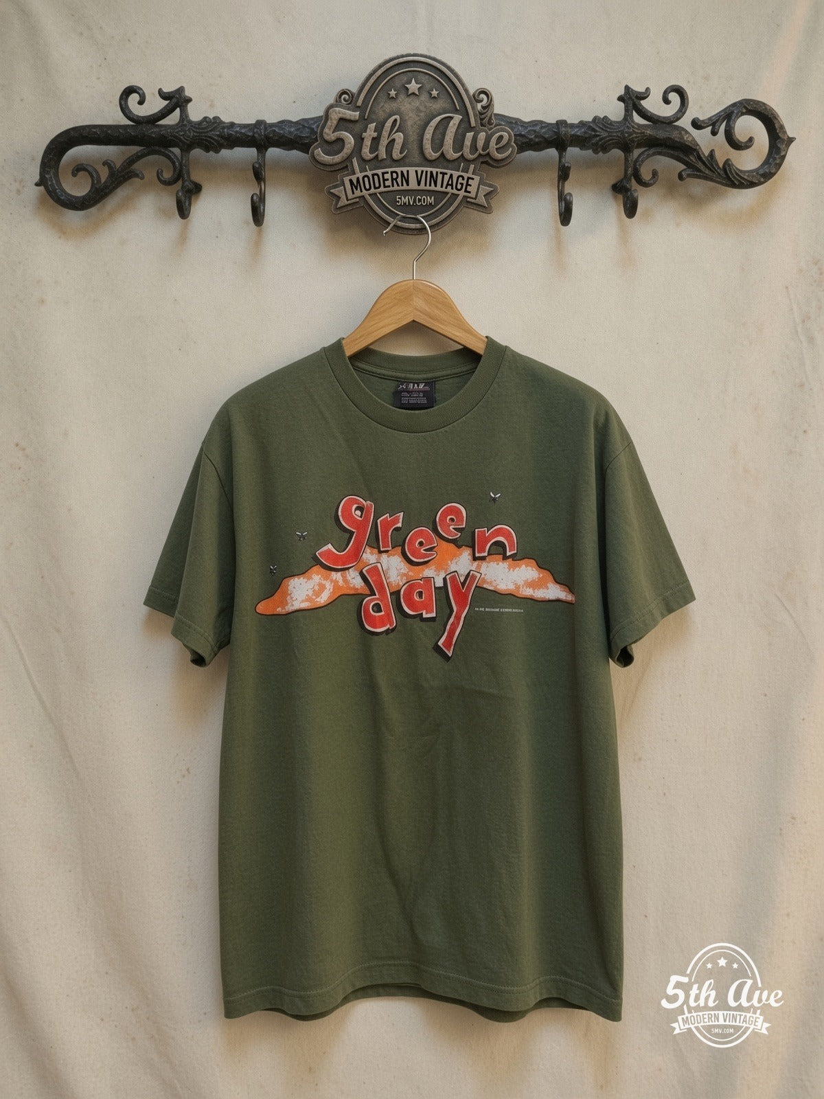 Green Day – Dookie Logo Flies – Vintage Band T-Shirt — front on locked cream ornate 5th Ave rack