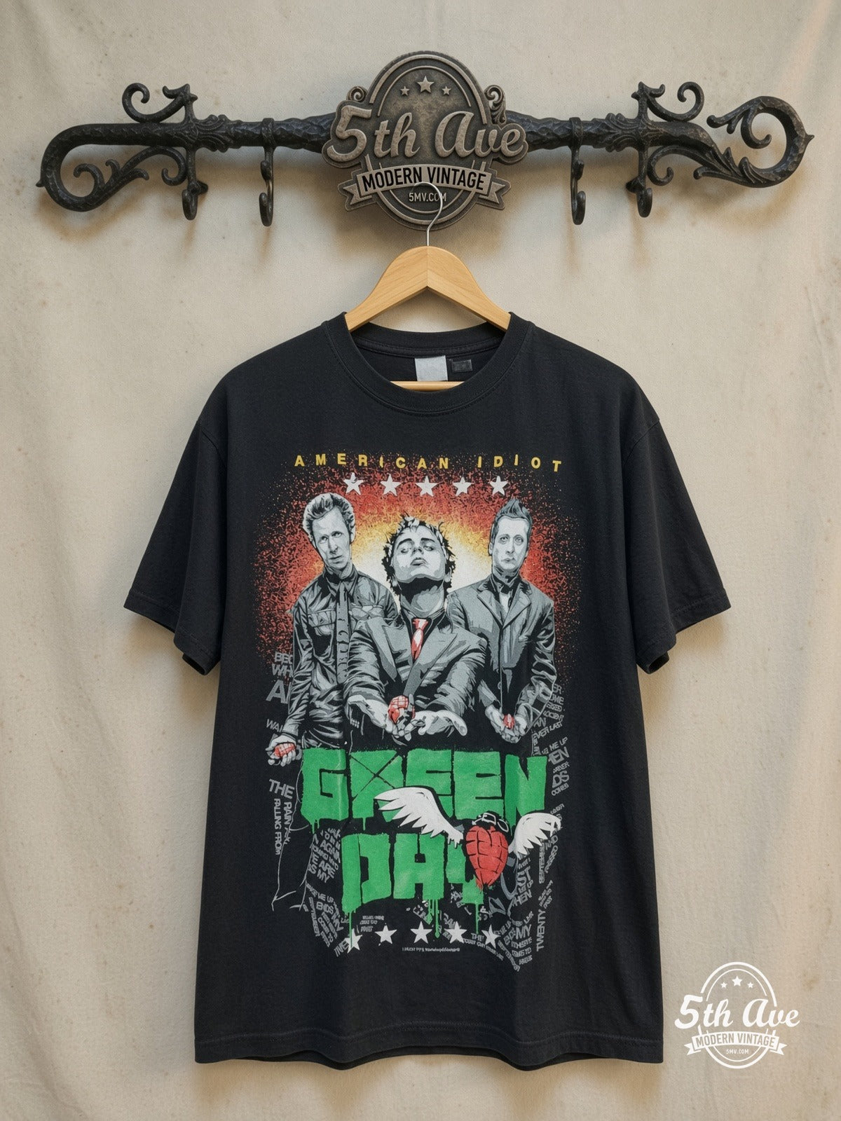 Green Day – American Idiot Band Trio Heart Grenade – Vintage Band T-Shirt — front on locked cream ornate 5th Ave rack