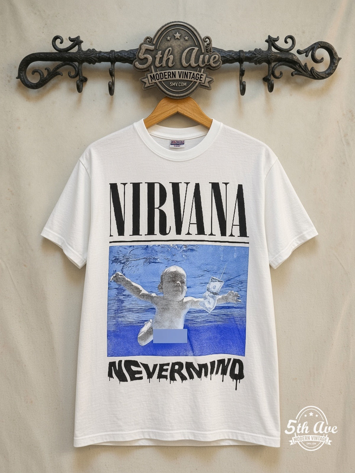 Nirvana – Nevermind Smiley – Vintage Band T-Shirt — front on locked cream ornate 5th Ave rack