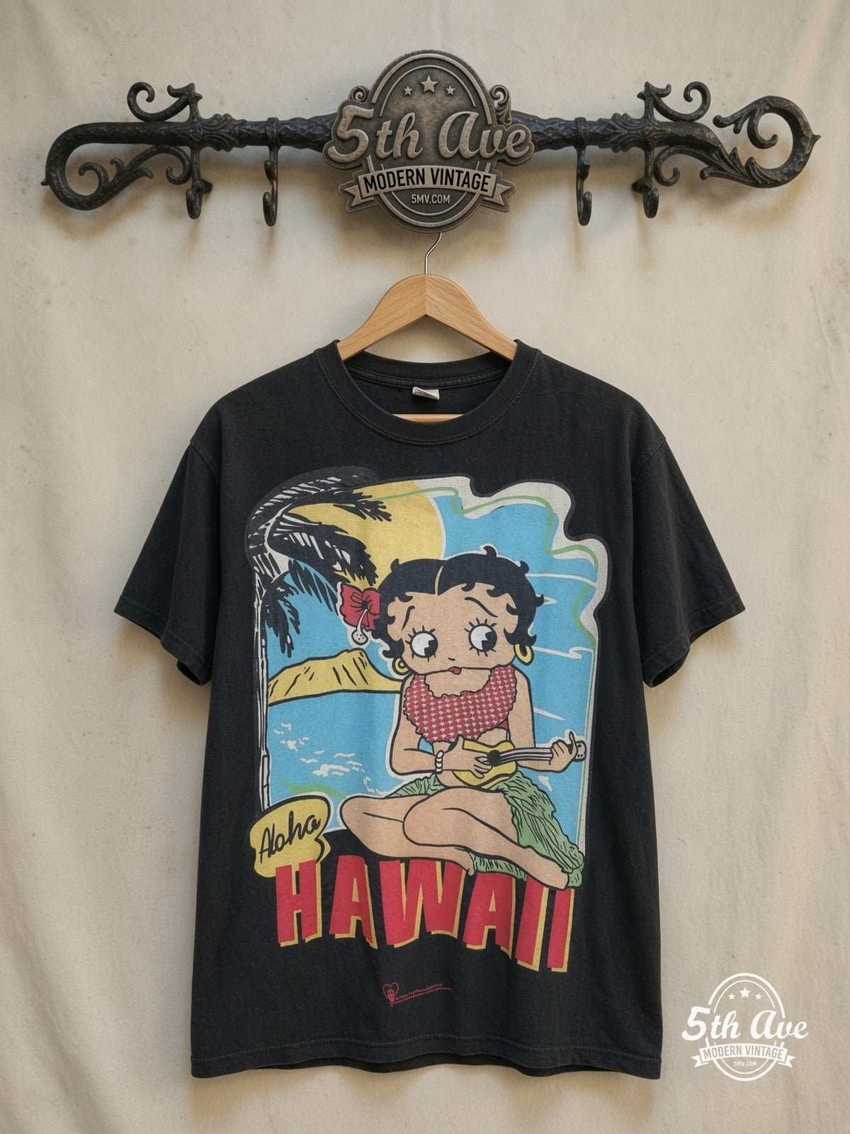 Betty Boop – Aloha Hawaii Polynesian Princess – New Vintage Graphic Tee — front on locked cream ornate 5th Ave rack