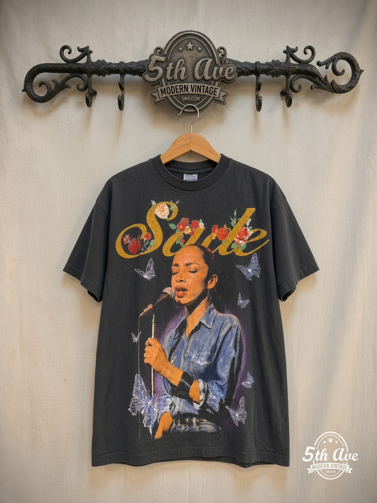Sade – The Best of Sade – Vintage Band T-Shirt — front on locked cream ornate 5th Ave rack