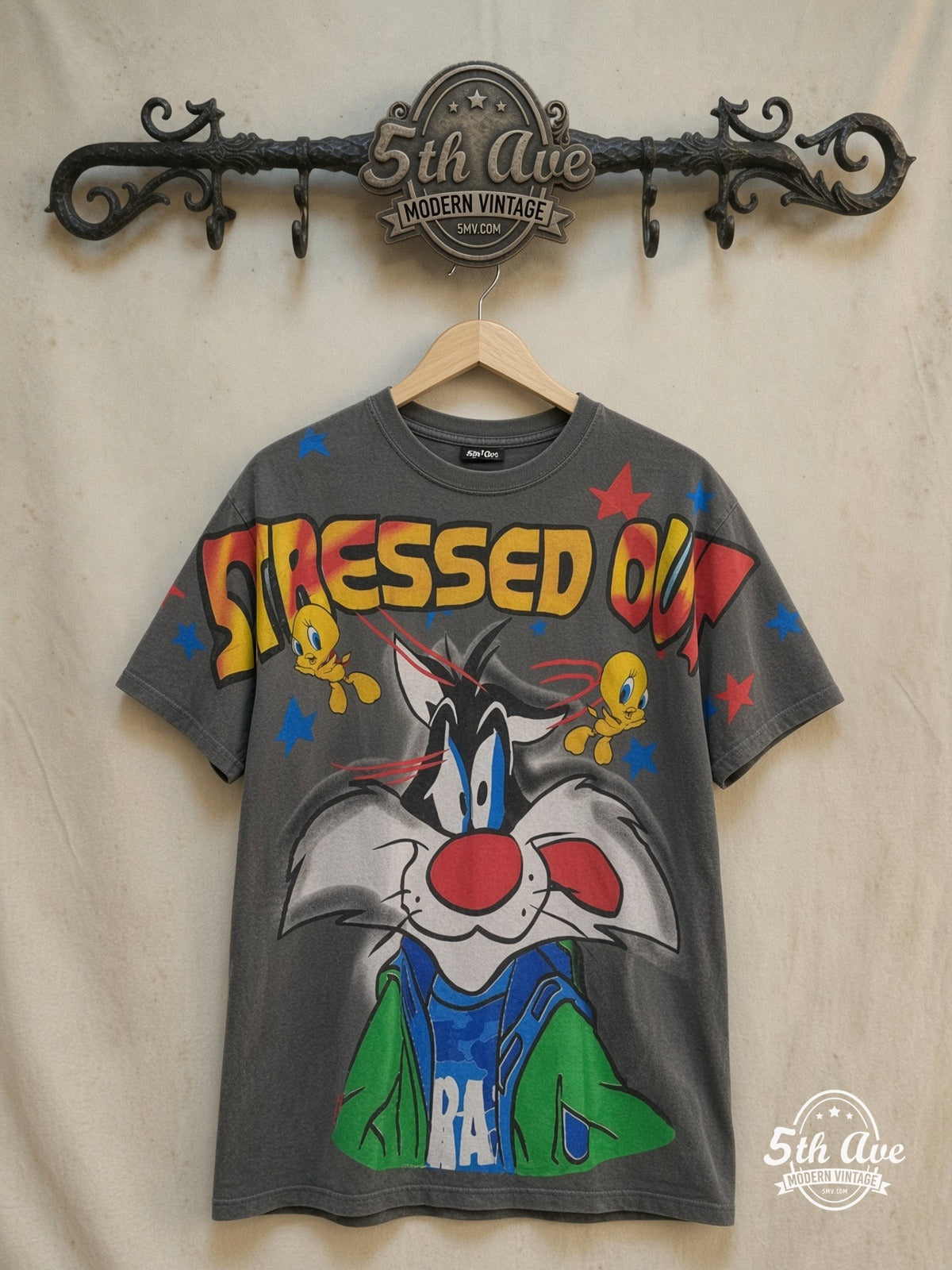 Looney Tunes – Sylvester and Tweety Stressed Out – All Over Print – New Vintage Graphic Tee — front on locked cream ornate 5th Ave rack