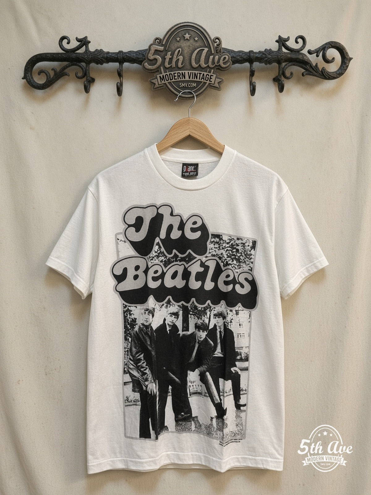 The Beatles – Yellow Bubble Font Early Photo – Vintage Band T-Shirt — front on locked cream ornate 5th Ave rack