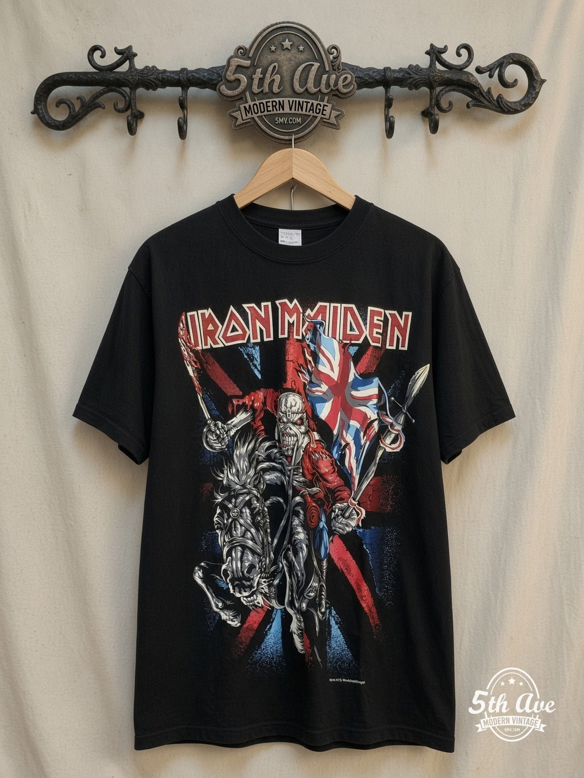 Iron Maiden – 100% Cotton New Vintage Band T-Shirt – Vintage Band T-Shirt — front on locked cream ornate 5th Ave rack