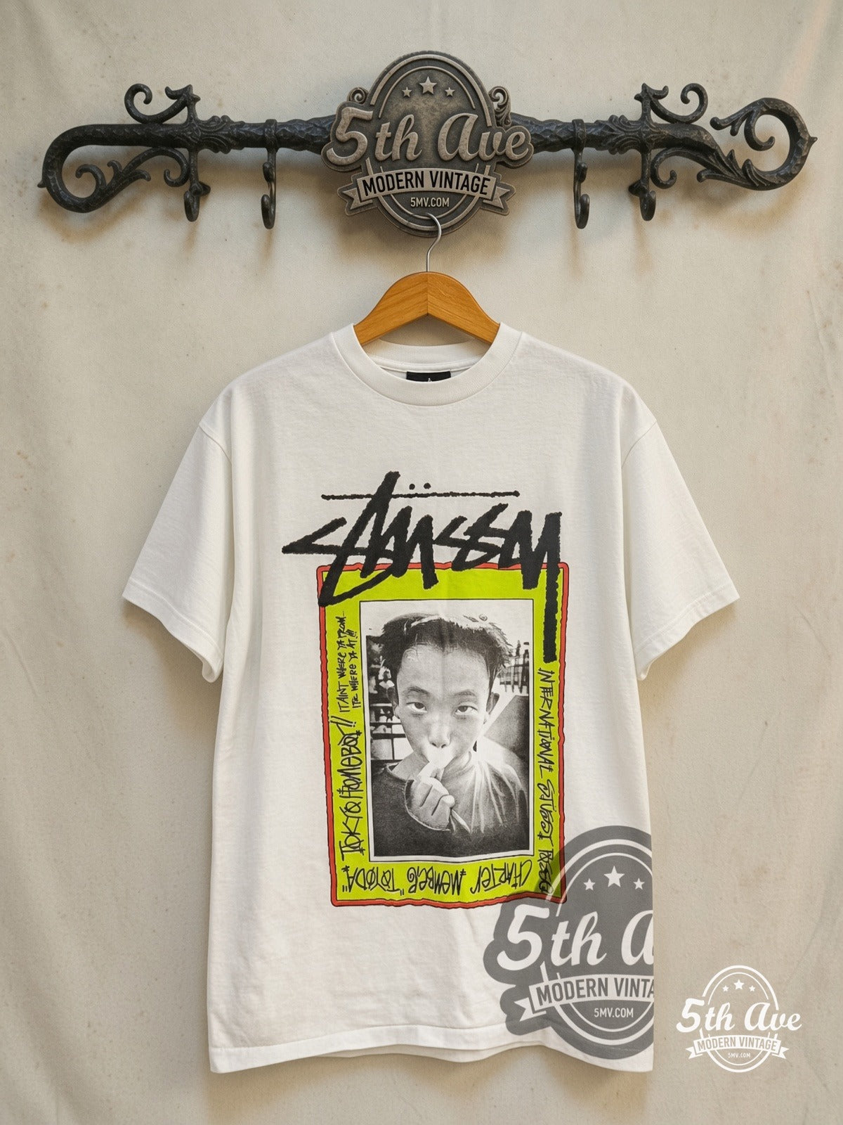 Stussy – Toyoda Tokyo Homeboy – Vintage Graphic Tee — front on locked cream ornate 5th Ave rack
