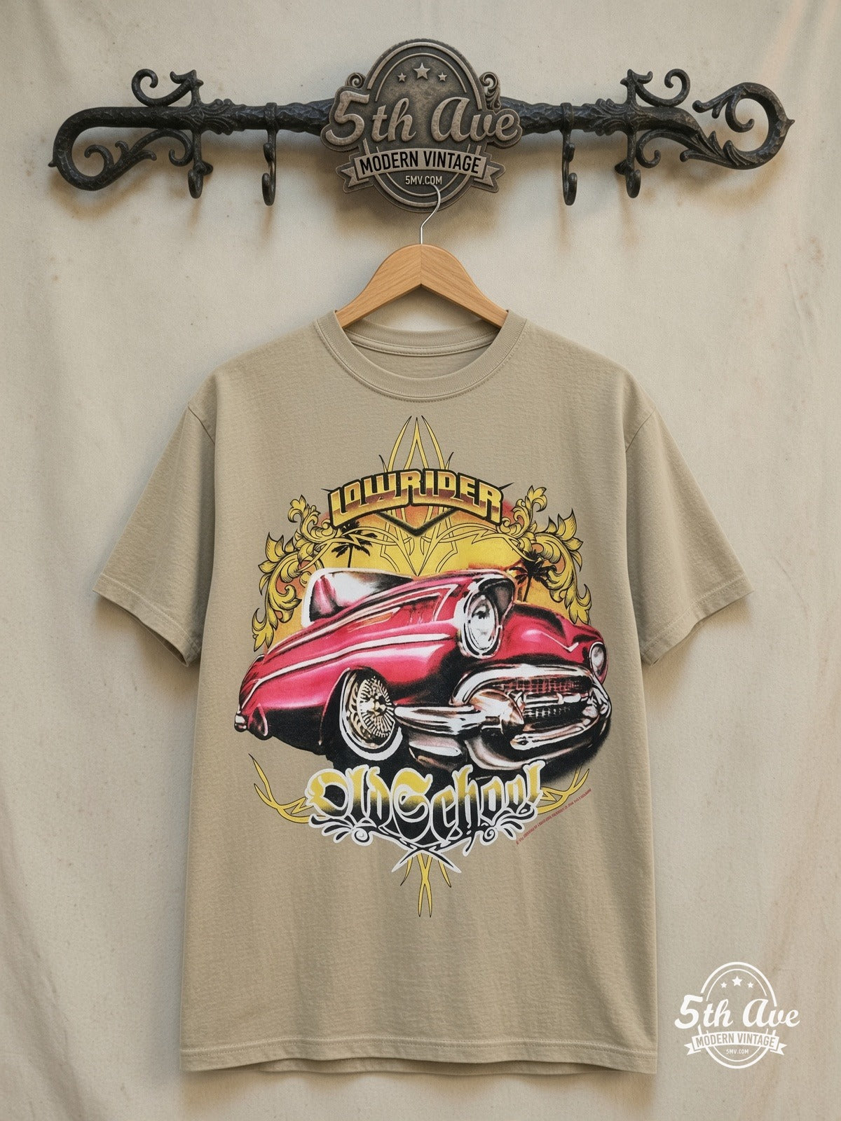 Rollin Hard Old School Lowrider graphic tee, front view on a display rack